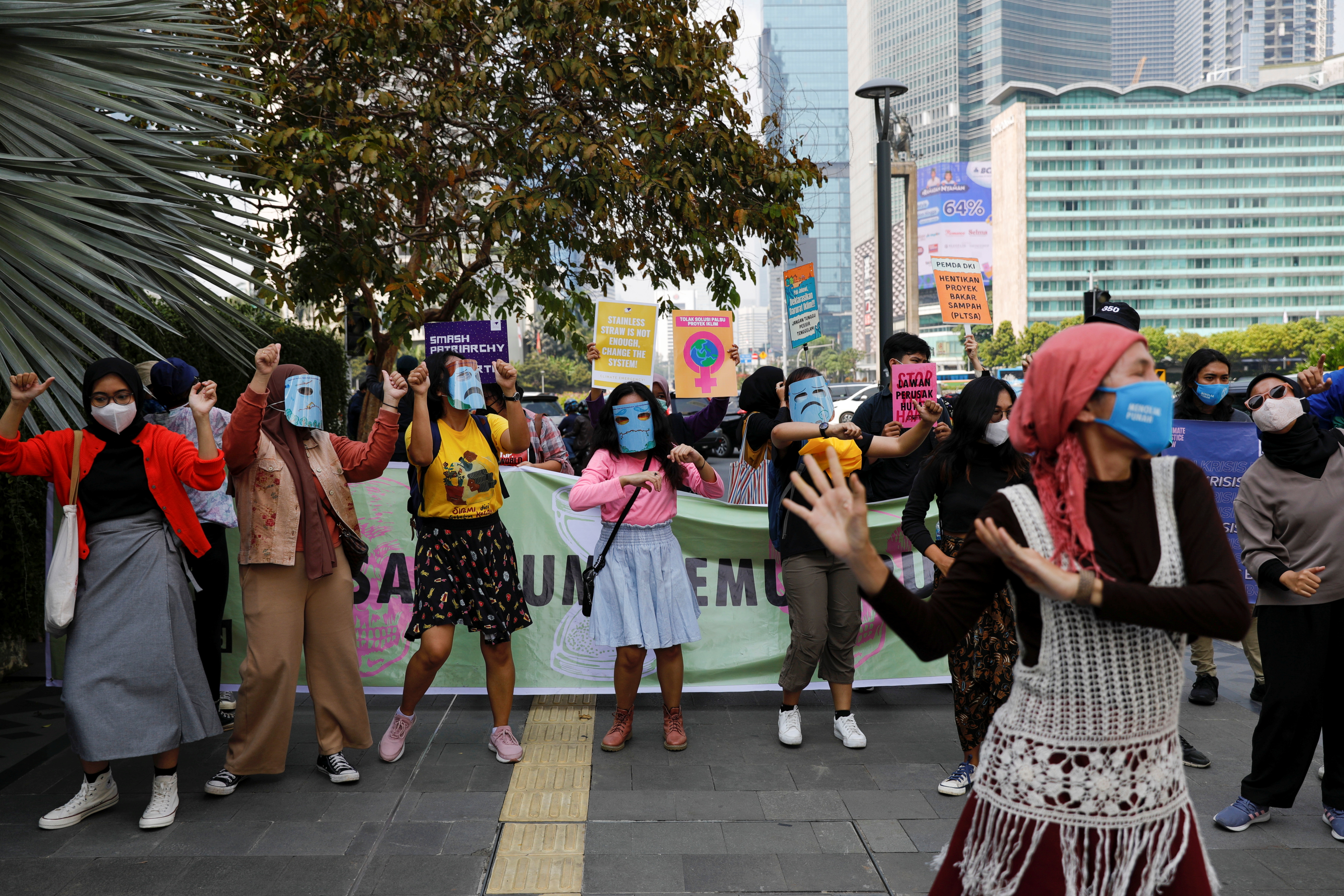 Activists carry banners and dance as they demonstrate on Earth Day in Jakarta, Indonesia (REUTERS/Willy Kurniawan)