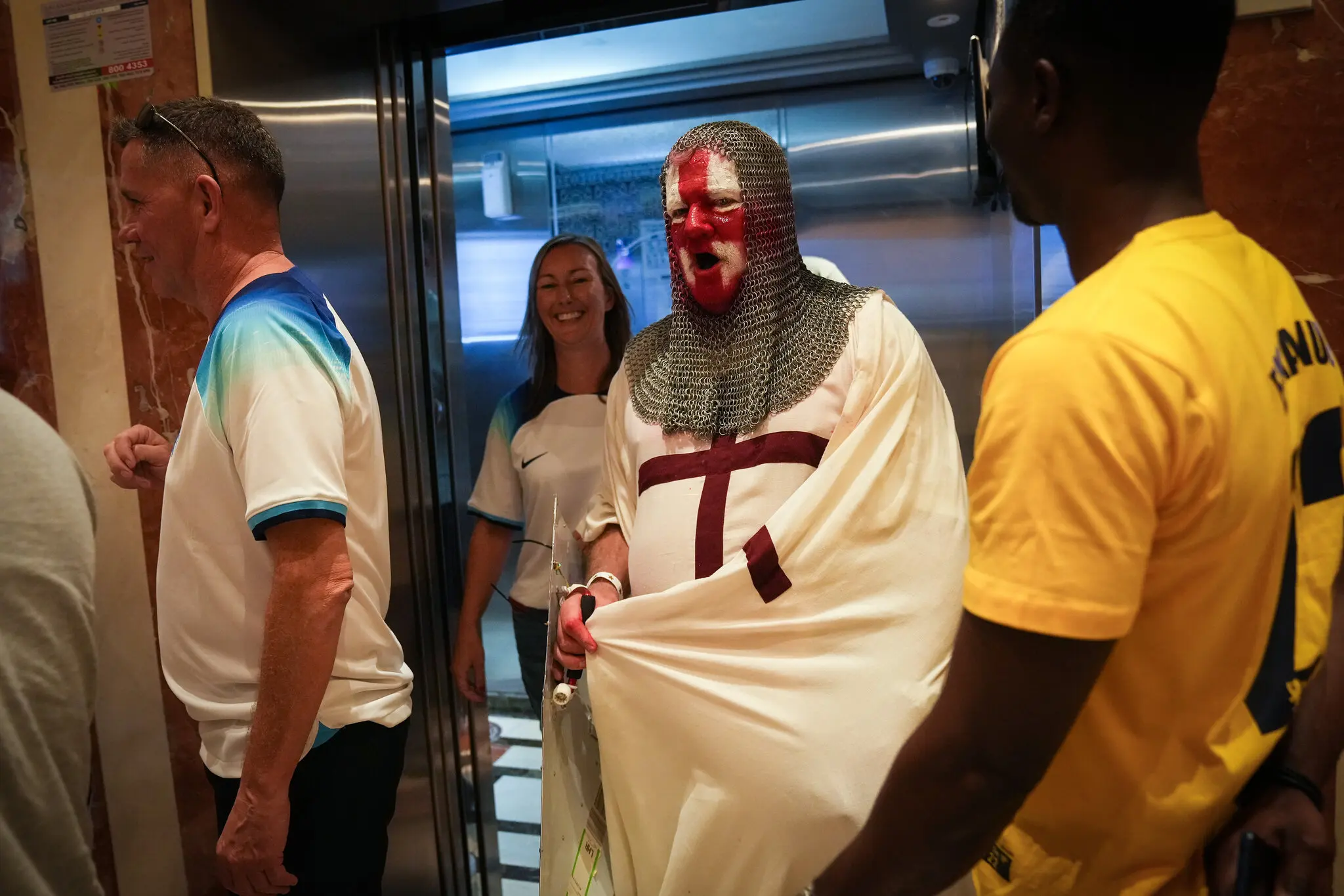 Dressed as Saint George, the patron saint of England, Paul Farrell leaves the Red Lion pub