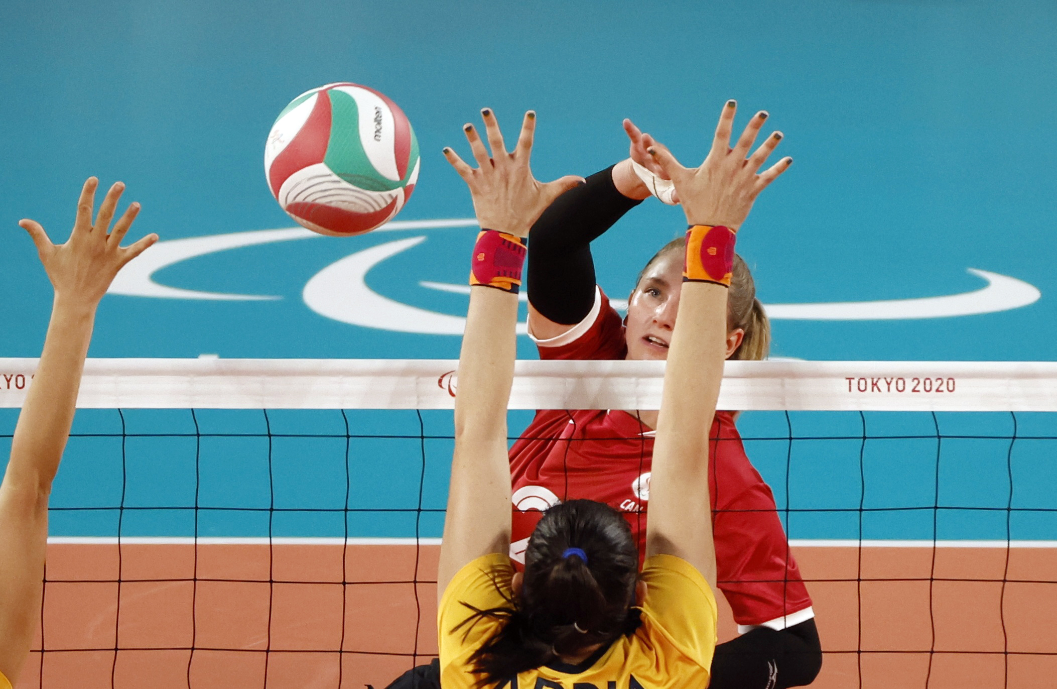 Tokyo 2020 Paralympic Games - Sitting Volleyball - Women's Bronze Medal Match - Brazil v Canada - Makuhari Messe Hall A, Chiba, Japan - September 4, 2021. Julie Kozun of Canada and Adria Jesus da Silva of Brazil in action REUTERS/Issei Kato