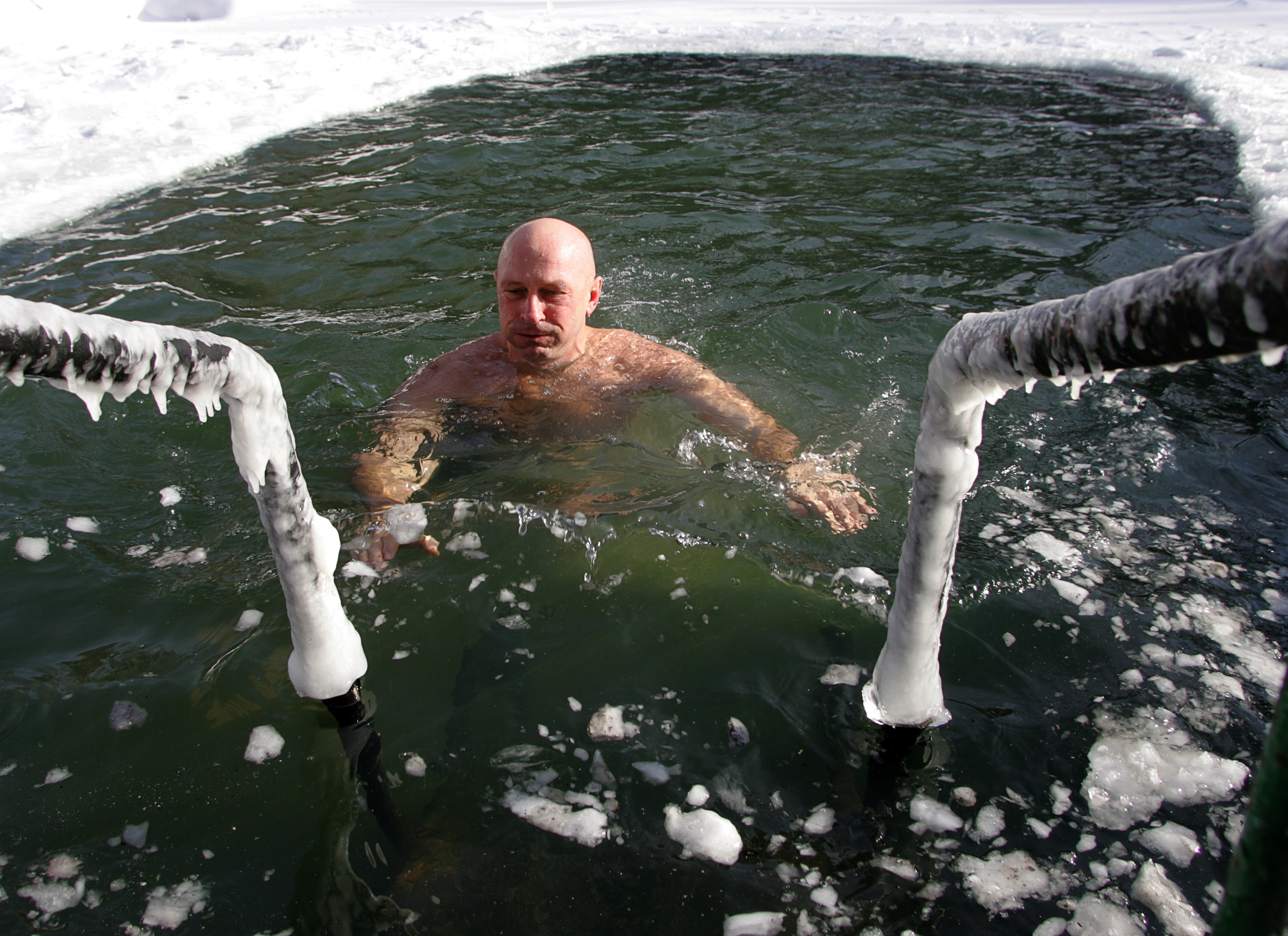 Swimming in cold temperatures can reduce inflammatory responses that cause anxiety and depression (Tima Korodaev/Epsilon/Getty Images)