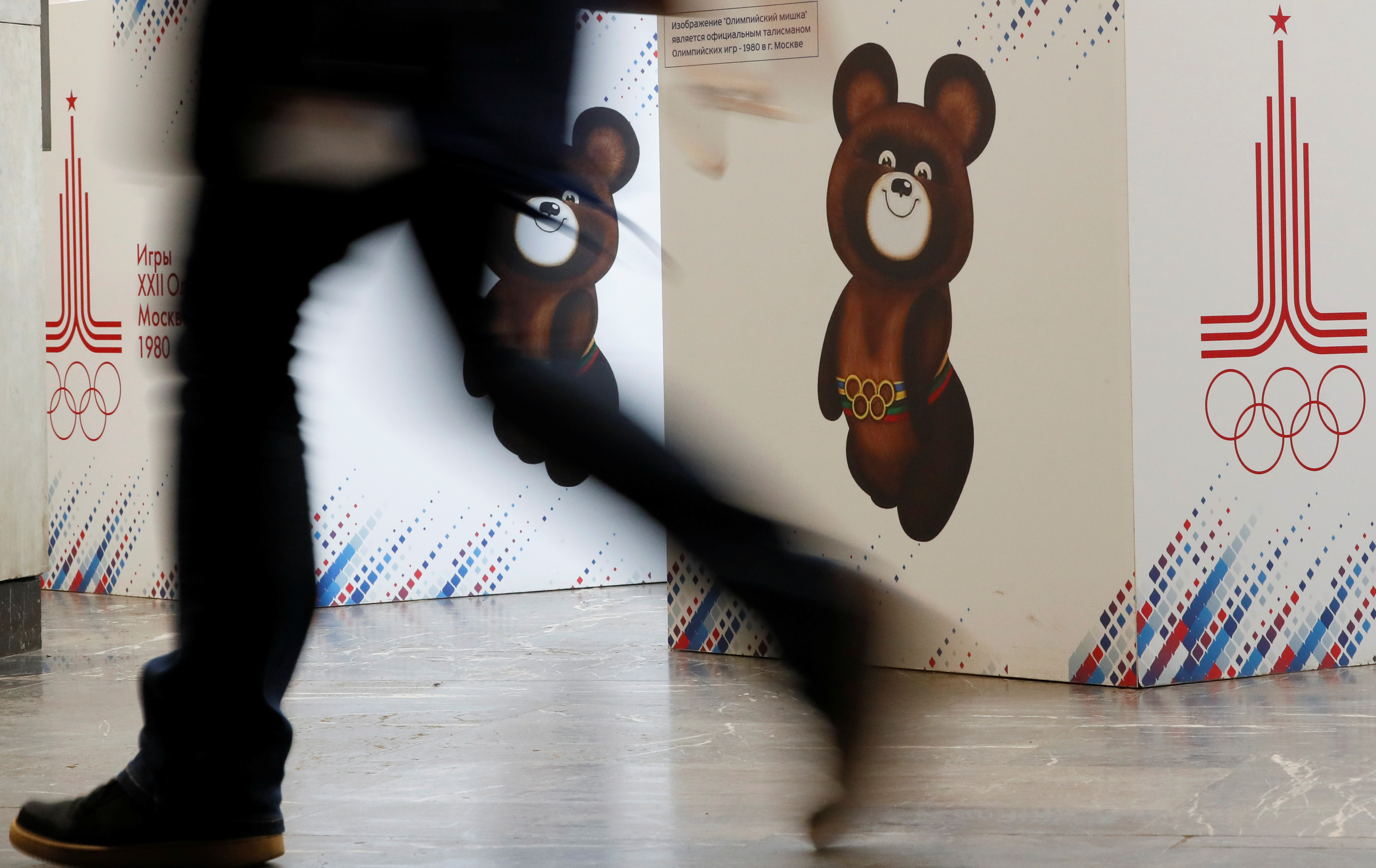 A visitor walks past an exposition displaying images of Misha the Bear, the mascot of the 1980 Olympic Games, inside the headquarters of the Russian Olympic Committee in Moscow, Russia December 9, 2019. REUTERS/Shamil Zhumatov
