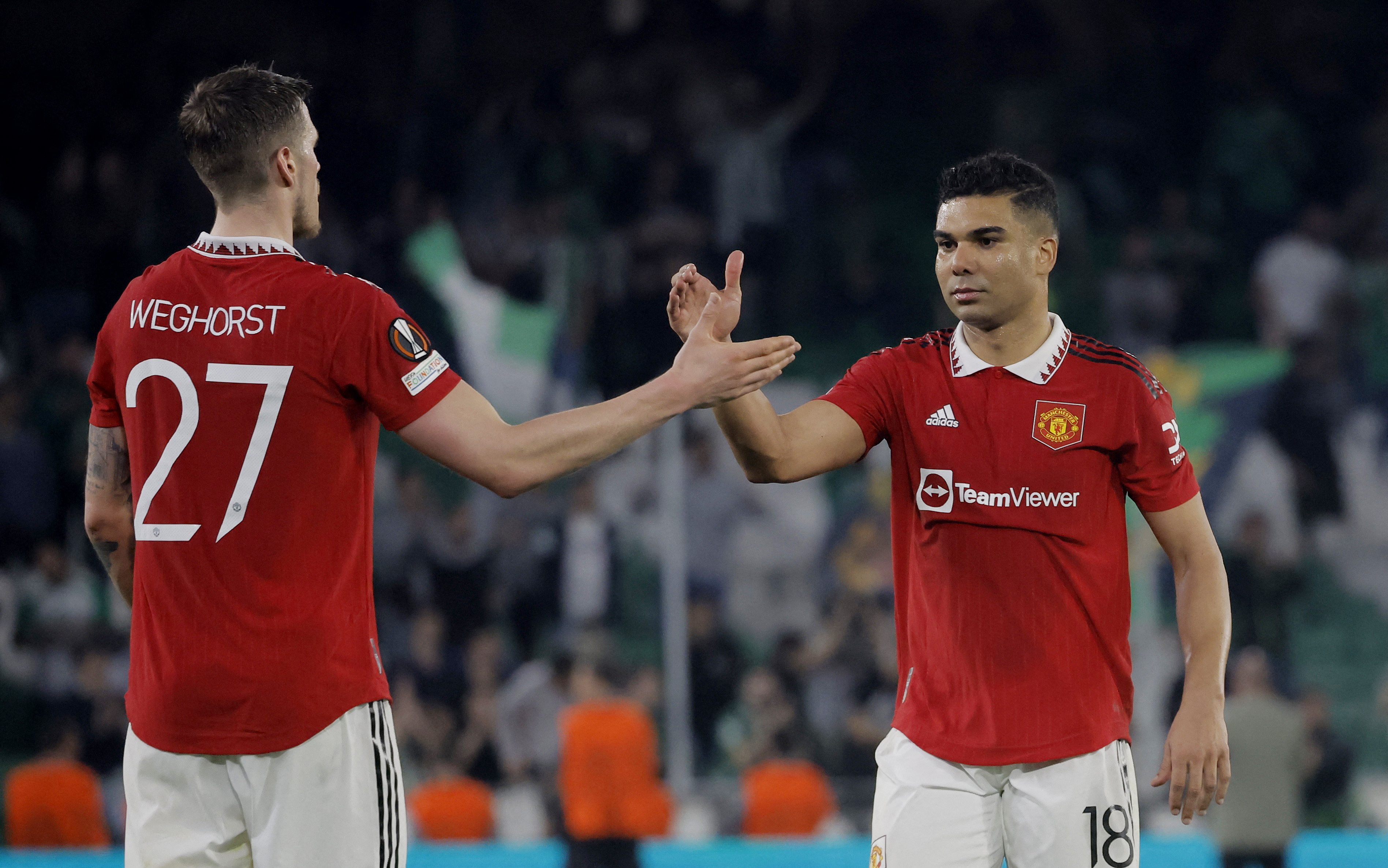 Soccer Football - Europa League - Round of 16 - Second Leg - Real Betis v Manchester United - Estadio Benito Villamarin, Seville, Spain - March 16, 2023  Manchester United's Casemiro celebrates with Wout Weghorst after the match REUTERS/Jon Nazca