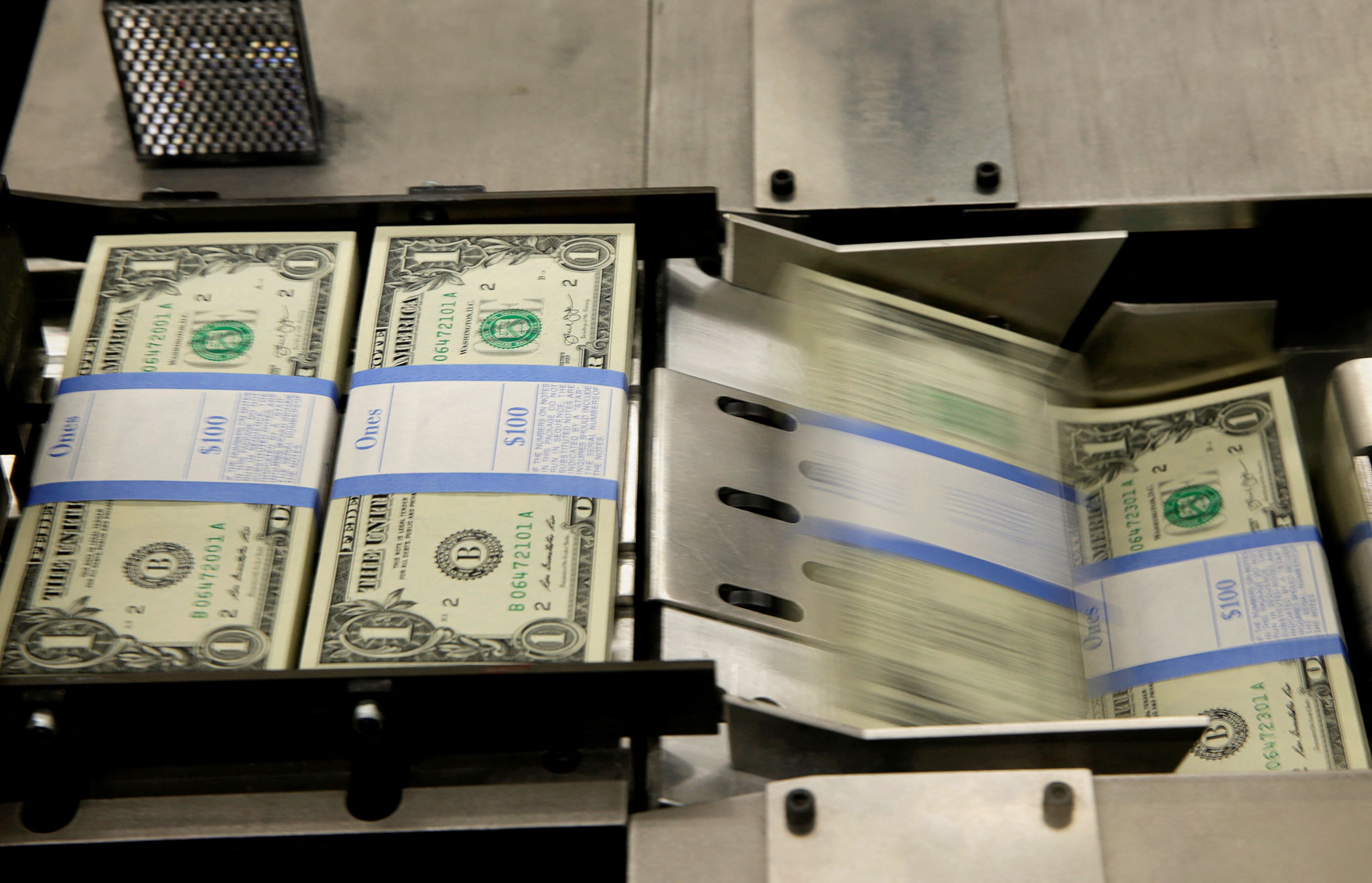FILE PHOTO: United States one dollar bills are put in packaging bands during production at the Bureau of Engraving and Printing in Washington
