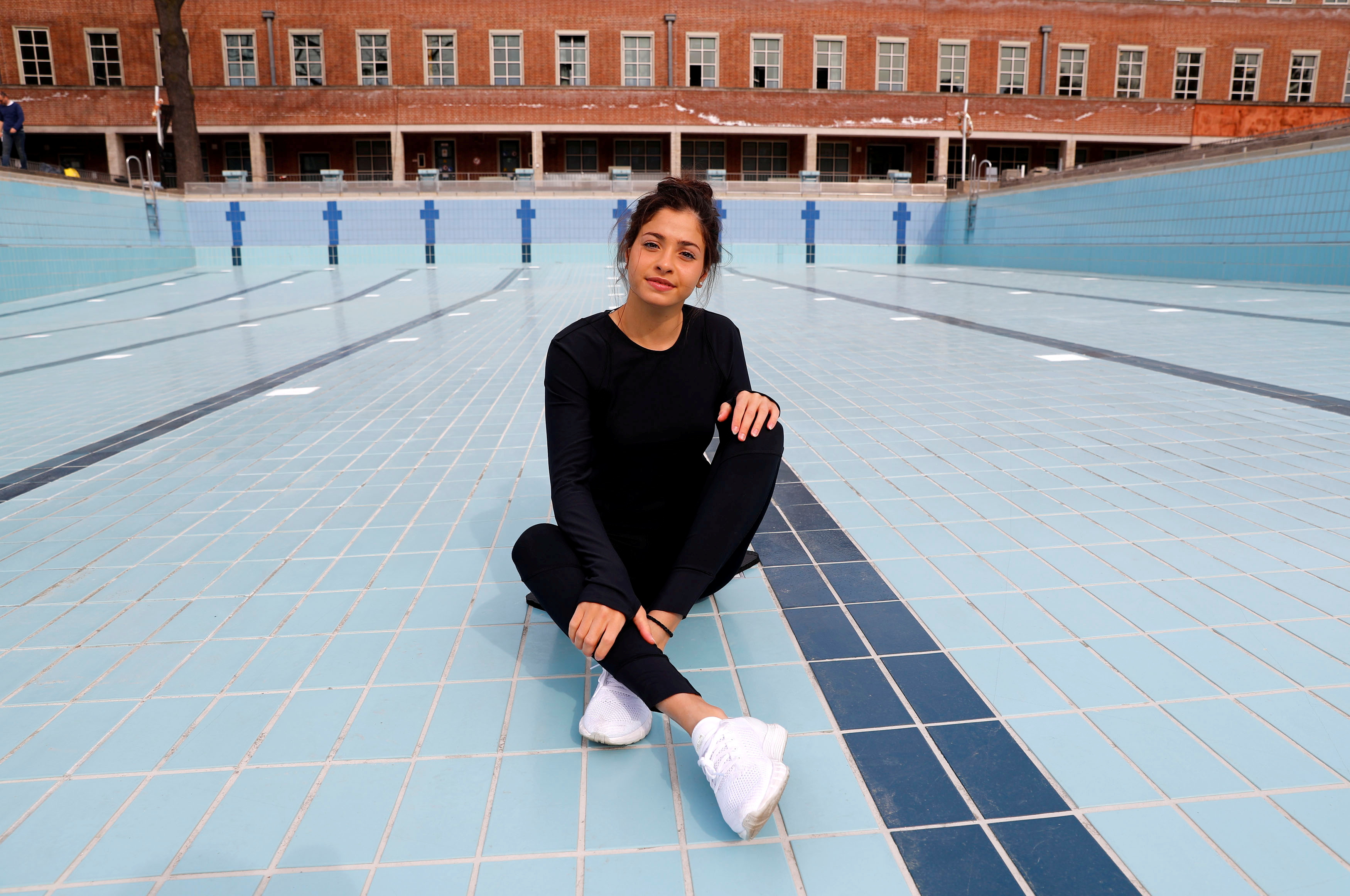 Syrian refugee and Olympic swimmer Yusra Mardini poses for the photographer after a training session in a pool at the Olympic park in Berlin