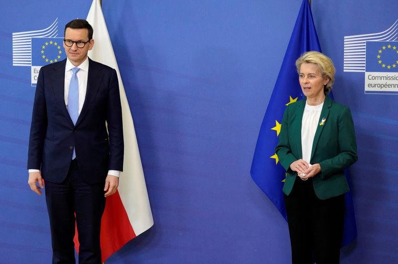 FILE PHOTO.  European Commission President Ursula von der Leyen poses with Poland's Prime Minister Mateusz Morawiecki before a meeting at the EU headquarters in Brussels, Belgium.  March 1, 2022. Virginia Mayo/Pool via REUTERS