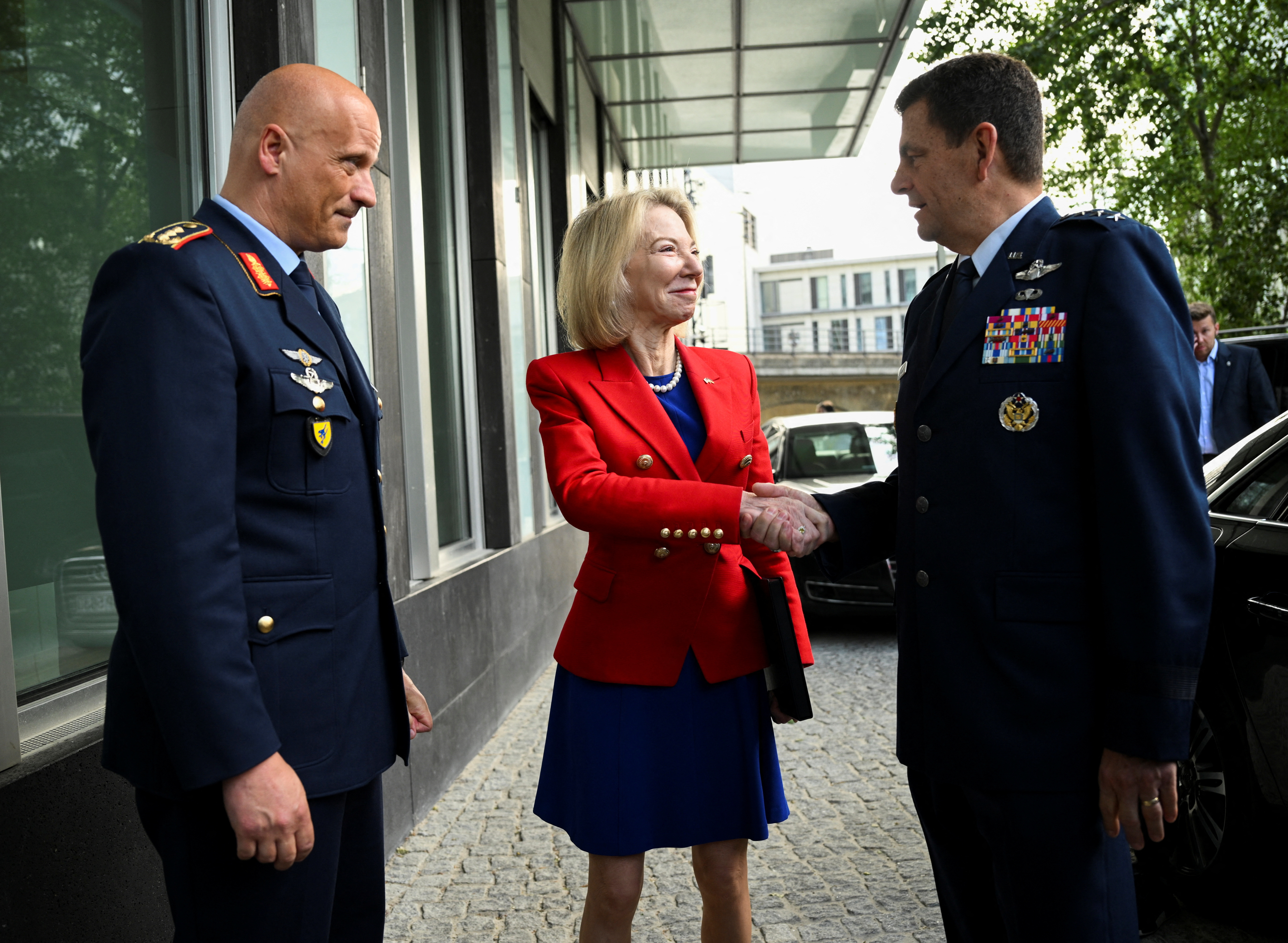 United States Ambassador to Germany Amy Gutmann, Inspector of the German Air Force, Lieutenant General Ingo Gerhartz and U.S. Air National Guard Director, Lieutenant General Michael A. Loh talk on the sidelines of a press conference about the Air Defender 23, the largest multinational deployment exercise of air forces in the history of NATO, in Berlin, Germany June 7, 2023. REUTERS/Annegret Hilse