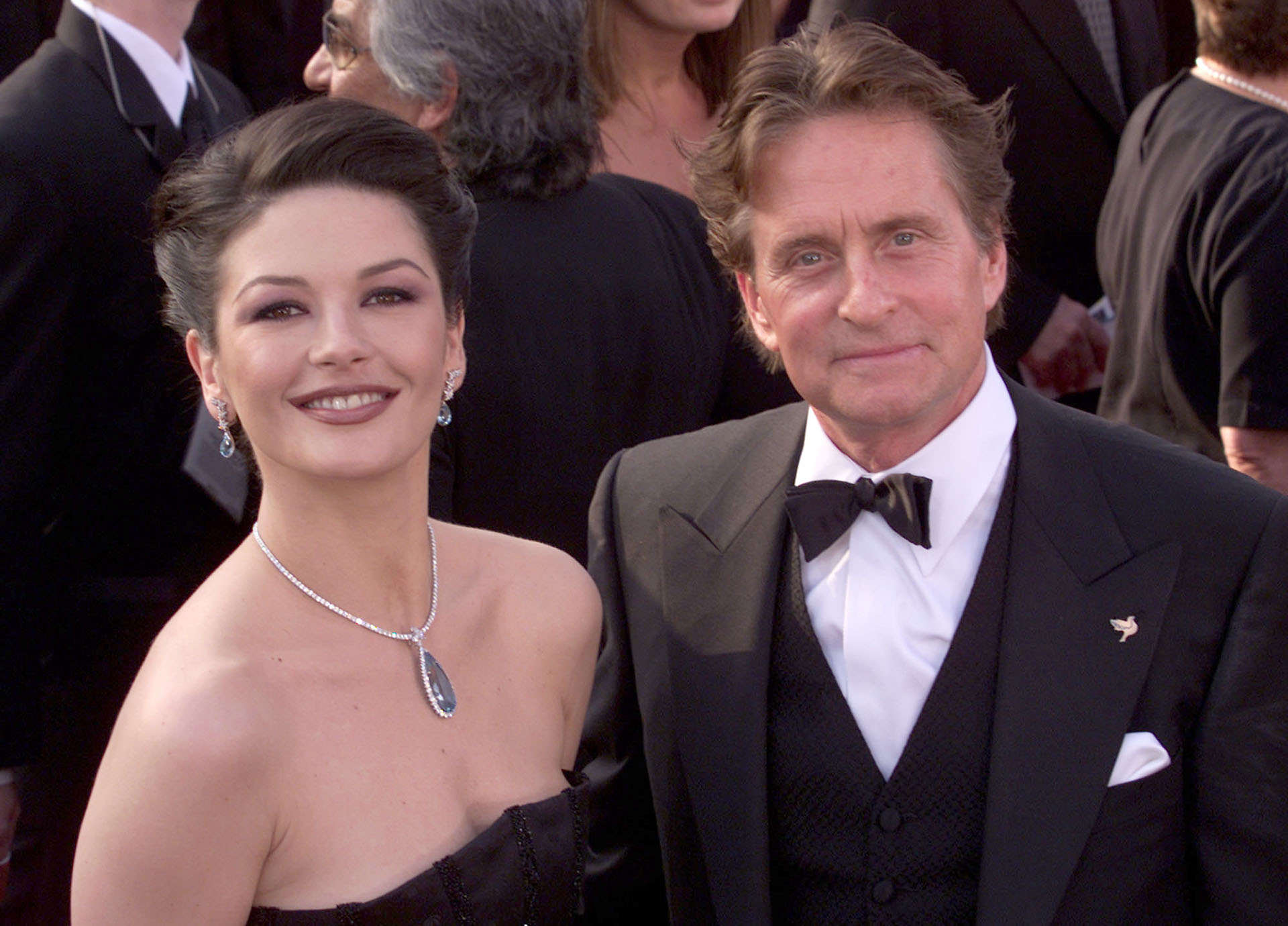 Catherine Zeta-Jones (left) and husband Michael Douglas, who co-starred in the nominee for the Best Motion Picture Of The Year, Traffic,  arrive at the 73rd Annual Academy Awards ceremony at the Shrine Auditorium in Los Angeles, CA on March 25, 2001. Photo credit: Kevin Winter/Getty Images