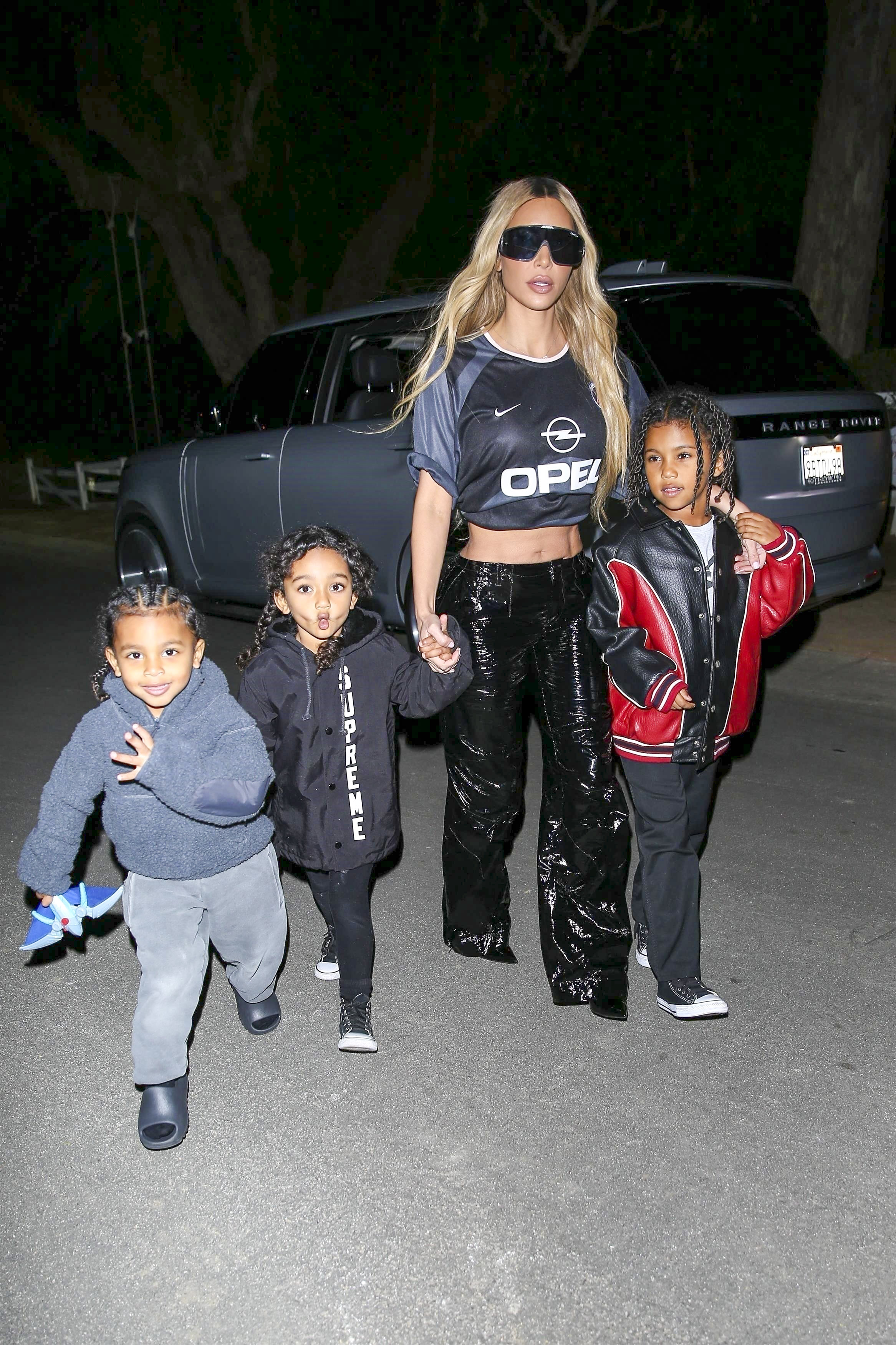 Kim Kardashian left Crossroads Kitchen after enjoying dinner with the kids in Calabasas.  In the midst of her ex-husband's conflicts, Kanye West, with Adidas, Kim decided to wear a Nike sports shirt.  The star also wore shiny black pants and dark glasses