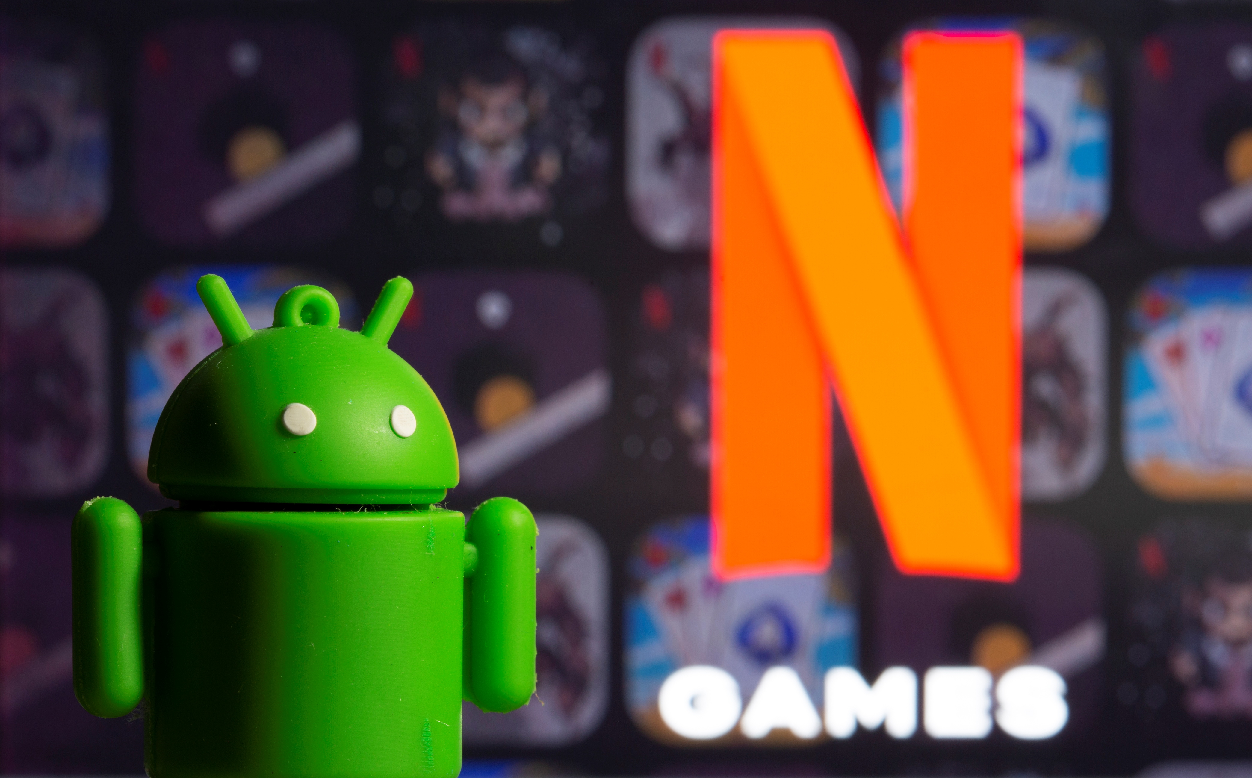 A 3D printed Android mascot Bugdroid is seen in front of the Netflix Games logo in this illustration taken November 3, 2021. REUTERS/Dado Ruvic/Illustration
