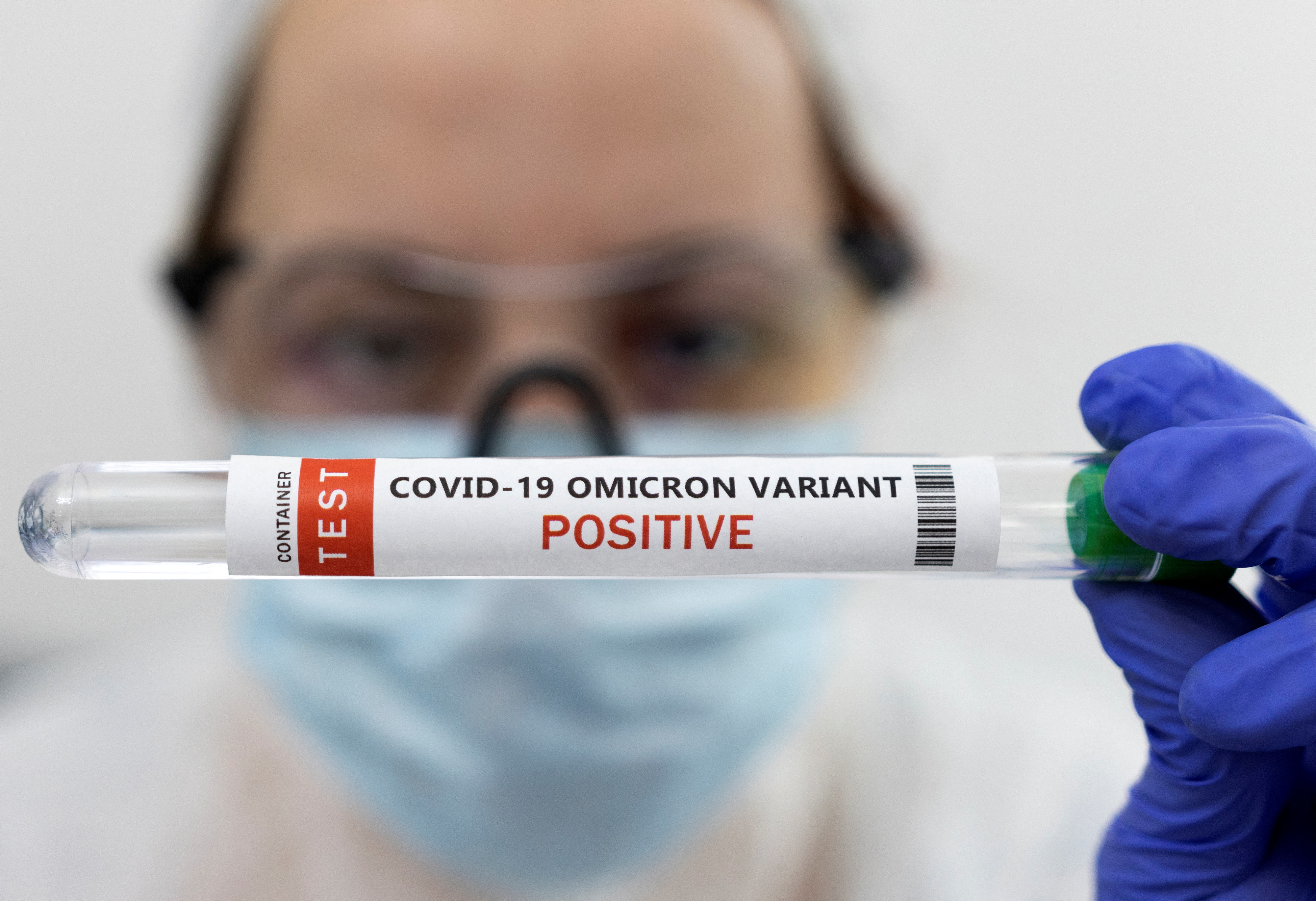 Test tube labelled "COVID-19 Omicron variant test positive" is seen in this illustration picture taken January 15, 2022. REUTERS/Dado Ruvic/Illustration