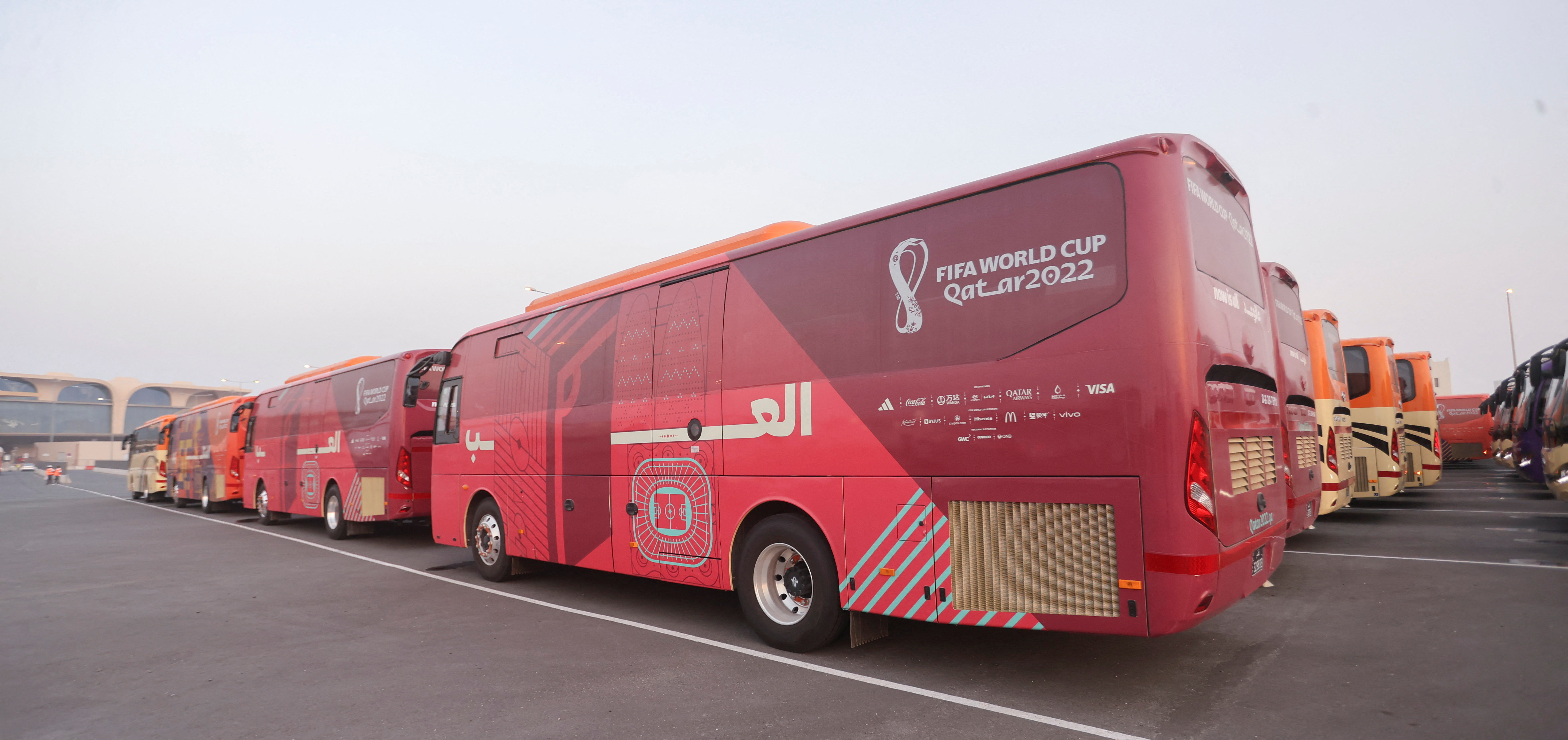 Buses which will be used for transportation for the FIFA World Cup Qatar 2022 are seen parked at a bus stop in Al Wakrah, during a "Bus Service Test Day Operation" connecting different soccer stadiums, ahead of the FIFA World Cup Qatar 2022 later this year, in Doha, Qatar, August 18, 2022. REUTERS/Ibraheem Al Omari