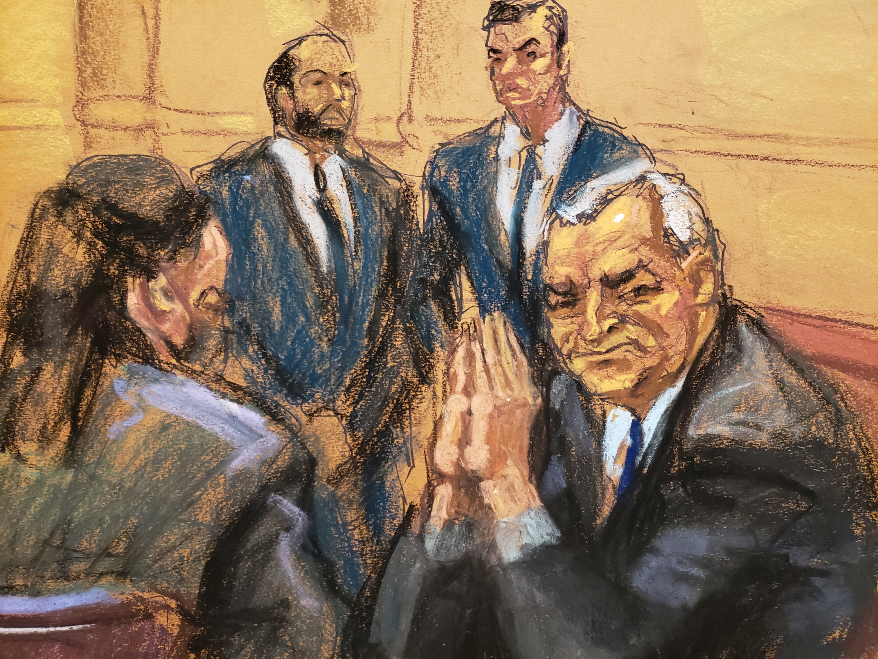 Mexico's former Public Security Minister Genaro Garcia Luna looks back at his wife seated in the audience during his trial on charges that he accepted millions of dollars to protect the powerful Sinaloa Cartel, once run by imprisoned drug lord Joaquin "El Chapo" Guzman, at a courthouse in New York City, U.S., January 30, 2023 in this courtroom sketch. REUTERS/Jane Rosenberg