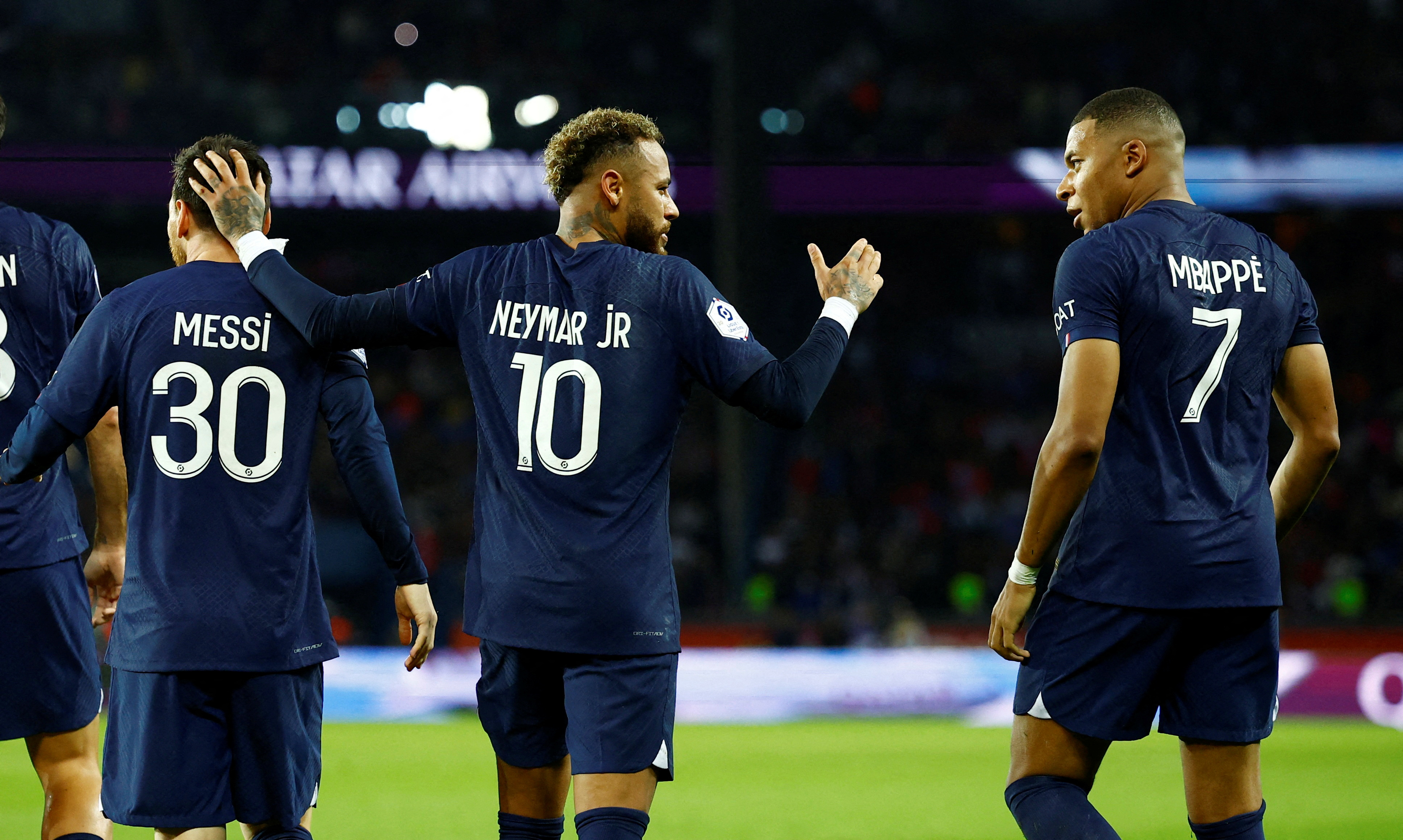 FILE PHOTO: Soccer Football - Ligue 1 - Paris St Germain v Olympique de Marseille - Parc des Princes, Paris, France - October 16, 2022 Paris St Germain's Neymar celebrates scoring their first goal with Kylian Mbappe and Lionel Messi REUTERS/Stephane Mahe/File Photo