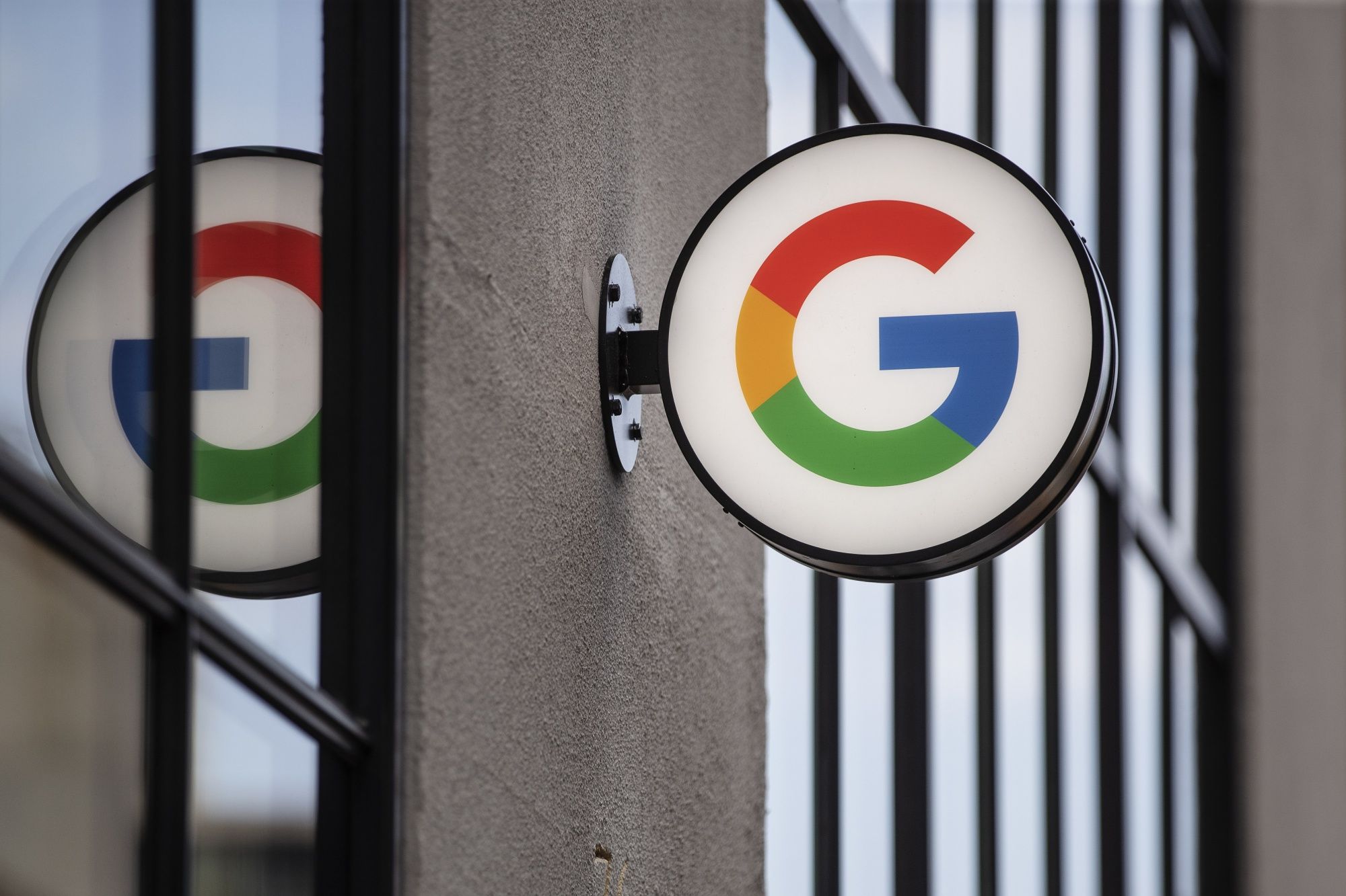 A logo outside the Google Store Chelsea in New York, U.S., on Friday, May 28, 2021. The Google Store will display and sell a variety of product such as Pixel phones, Nest smart home devices, Fitbit trackers, Pixelbooks, and more.