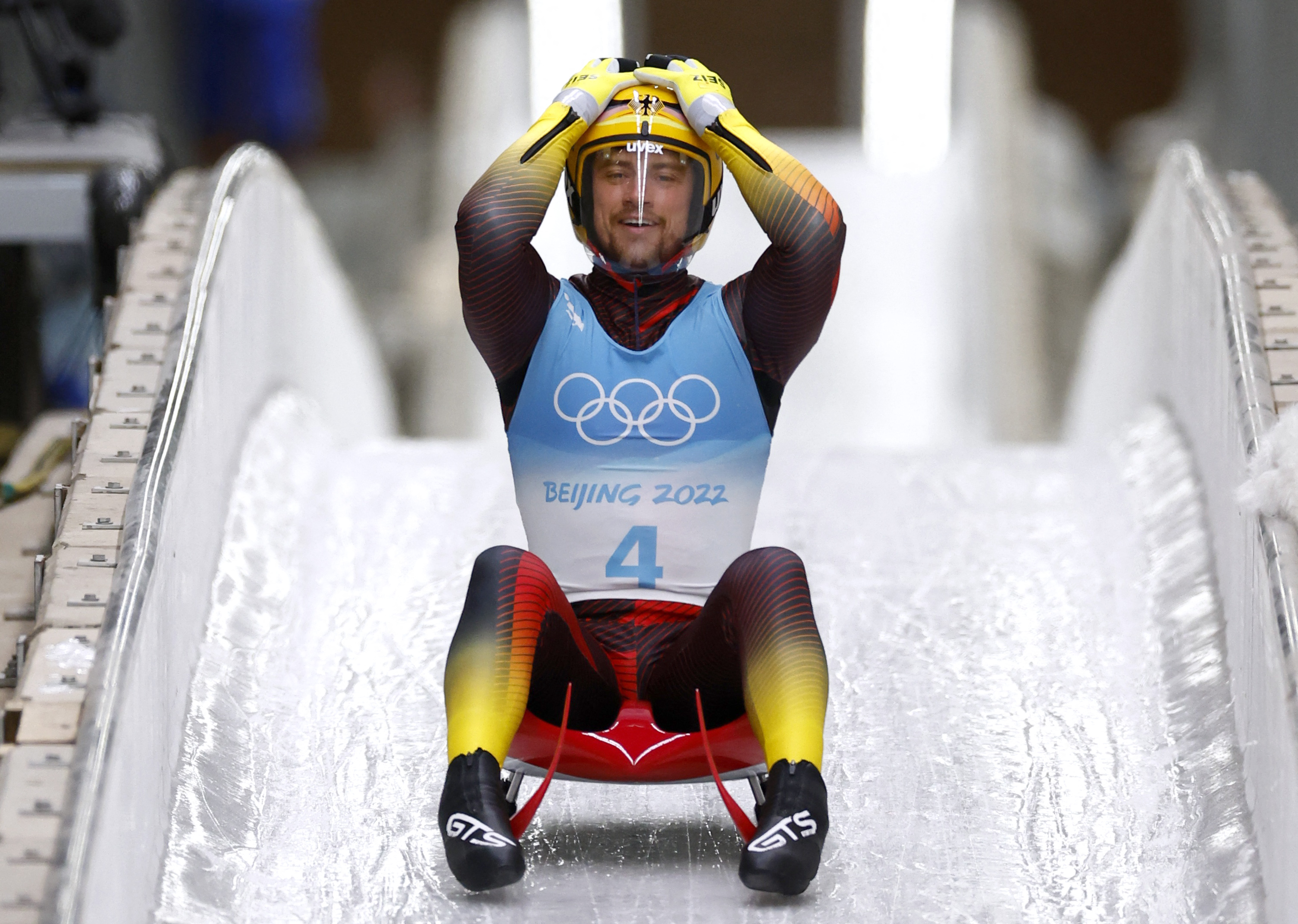 2022 Beijing Olympics - Luge - Men's Singles Run 4 - National Sliding Centre, Beijing, China - February 6, 2022. Johannes Ludwig of Germany reacts after winning gold. REUTERS/Thomas Peter