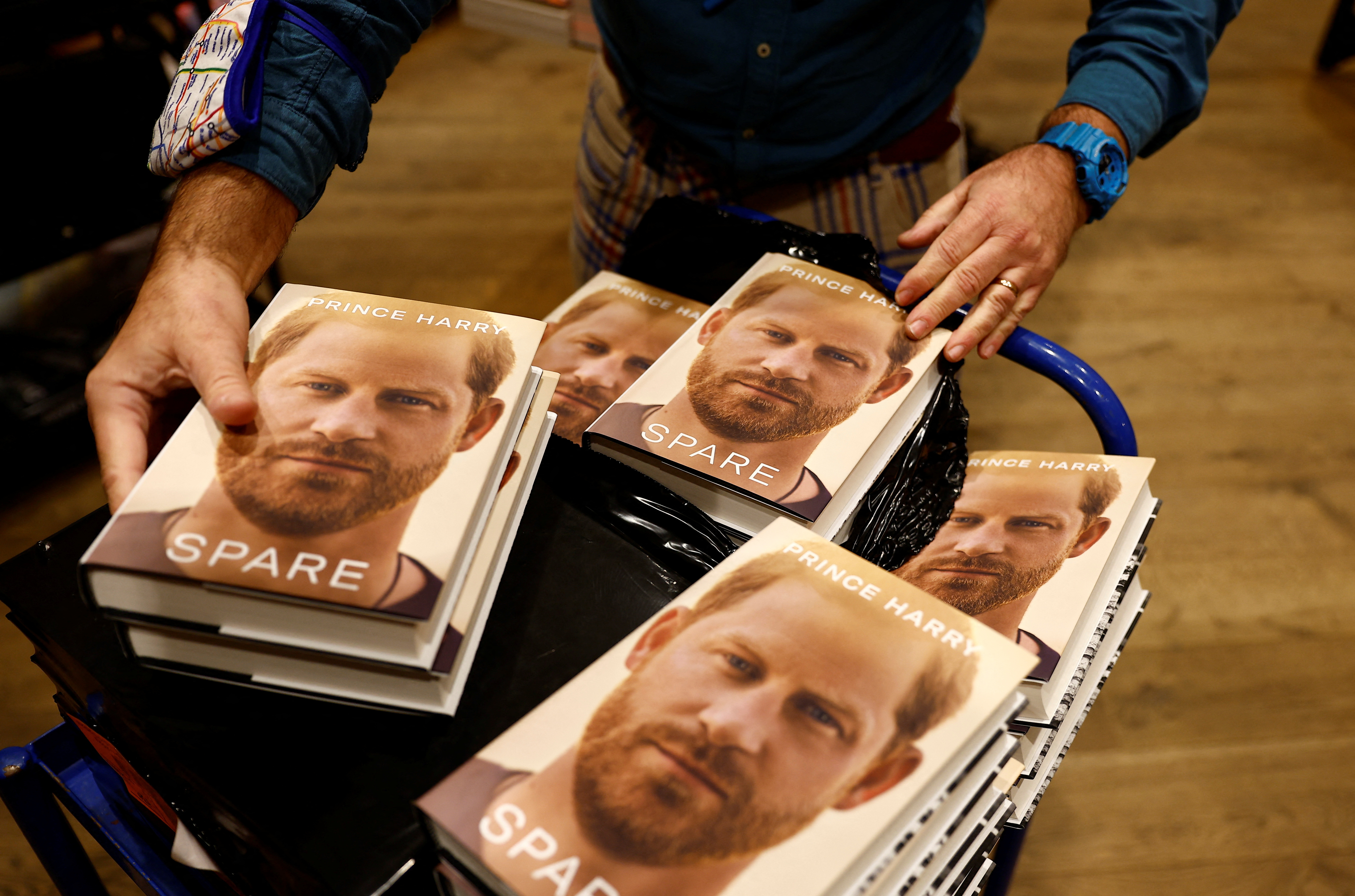 Bookshop staff stack books from Britain's Prince Harry's autobiography 'Spare' at Waterstones, London, Britain on January 10, 2023 (Reuters)