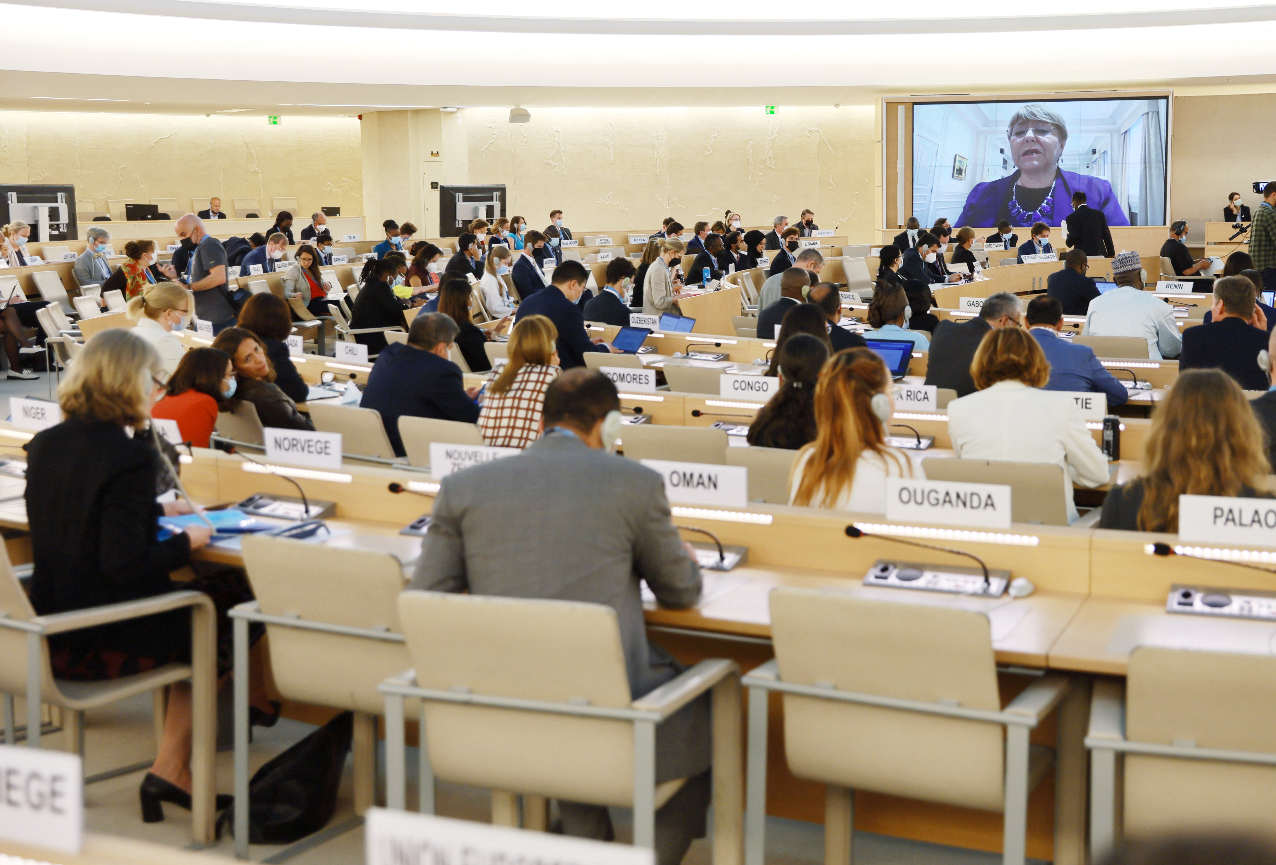 Michelle Bachelet, United Nations High Commissioner for Human Rights, appears on a screen during her video address at the Human Rights Council special session on the situation of human rights in Ukraine, at the United Nations in Geneva, Switzerland , on May 12, 2022. REUTERS/Denis Balibouse