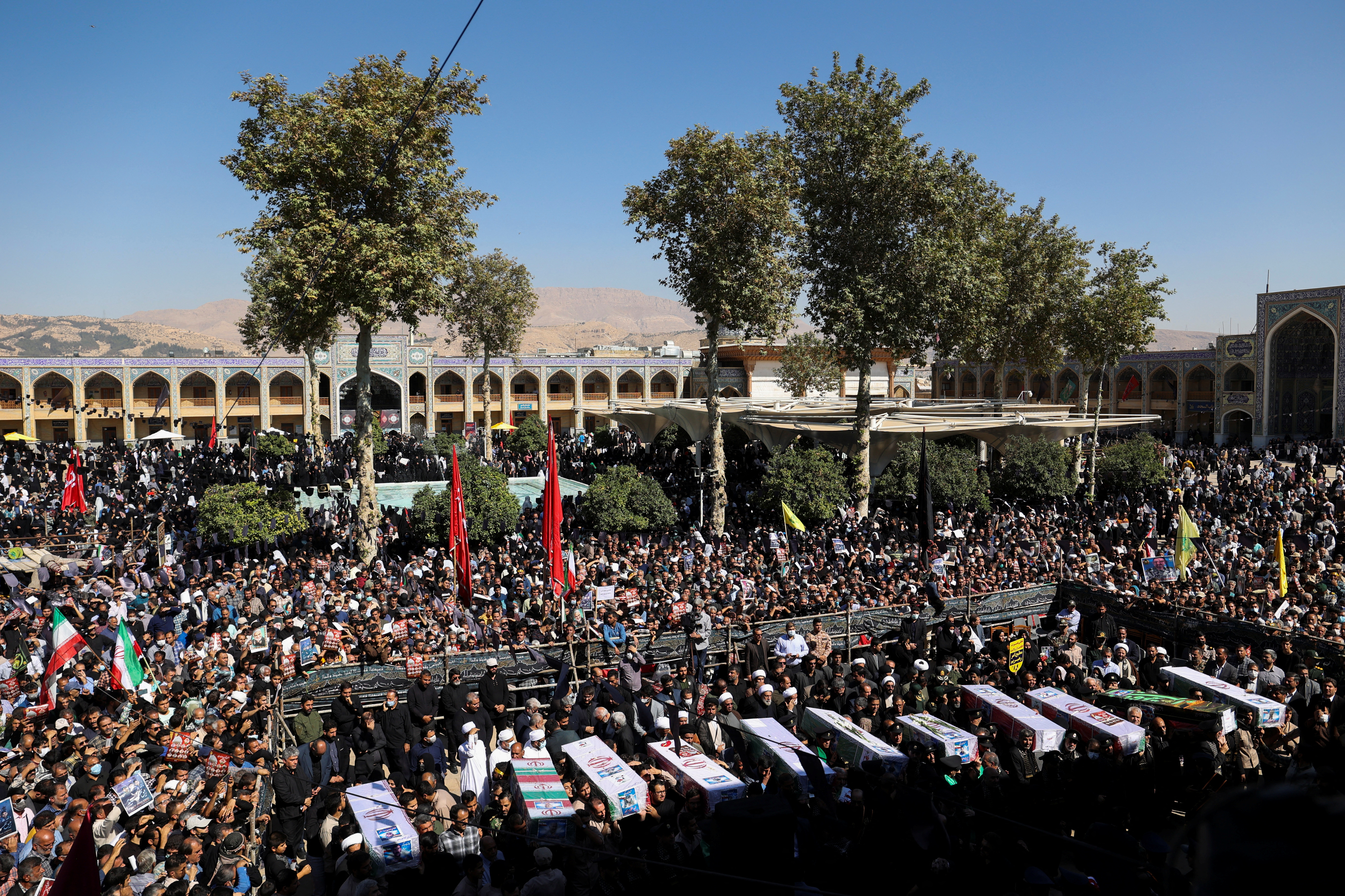 Funeral ceremonies carry the coffins of Shiraz attack victims. Majid Asgaripour/WANA via Reuters