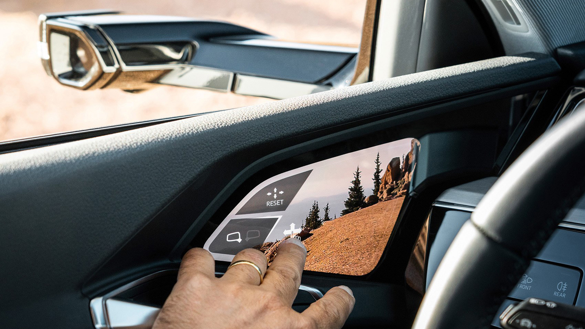 The screen inside the door shows what the cameras in the traditional place of the Audi e-tron's mirrors see.