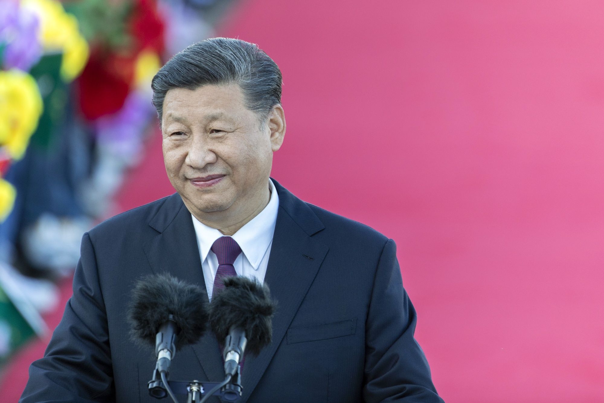Xi Jinping, China's president, delivers a speech after arriving at Macau International Airport in Macau, China, on Wednesday, Dec. 18, 2019. President Xi is expected to use a visit marking 20 years of Chinese rule over Macau this week to send a message to the protest-stricken financial hub some 50 kilometers (30 miles) to the east: work with us and get rich.