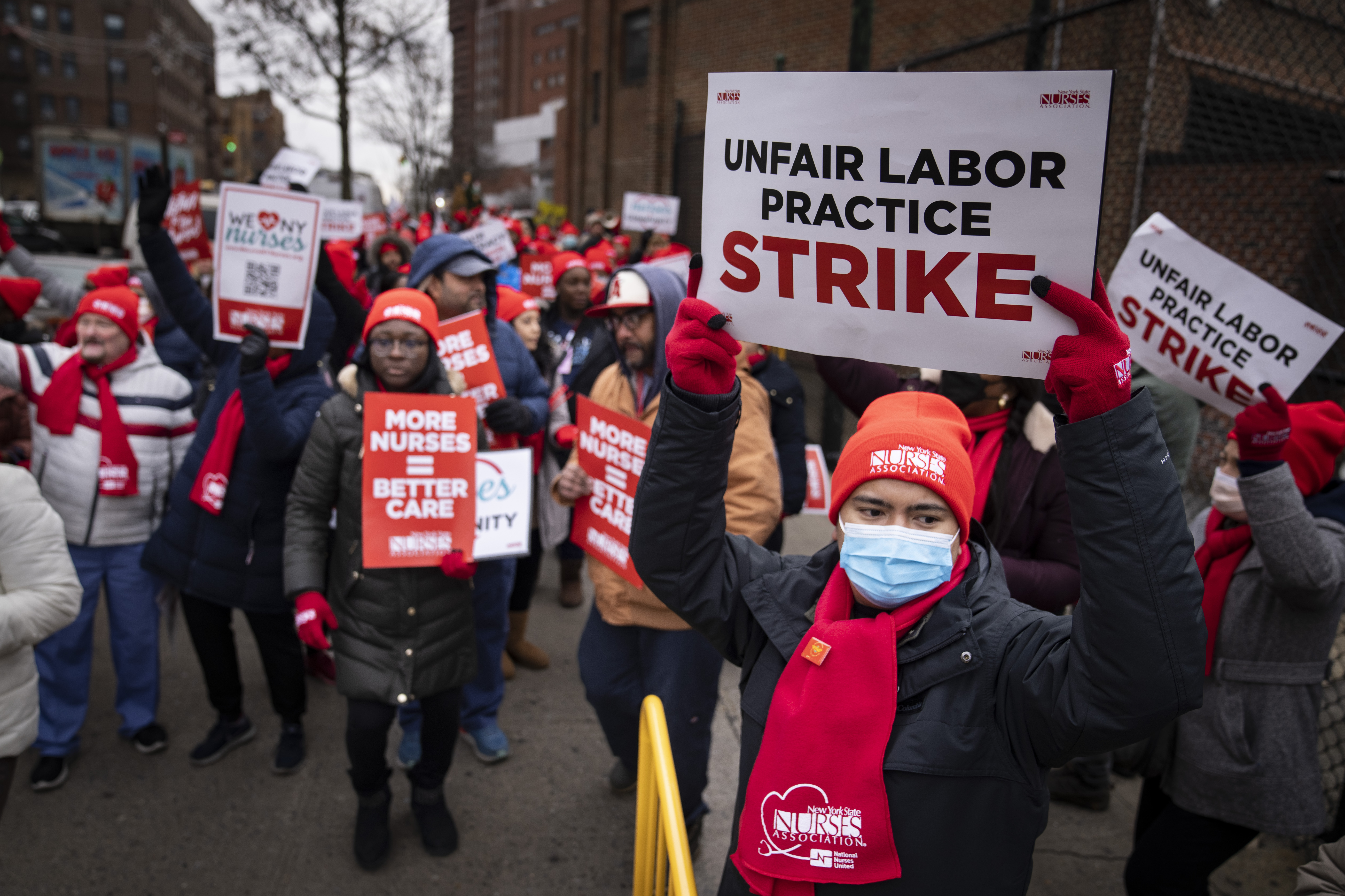 Protesters march in the street around Montefiore Medical Center during a nursing strike, Wednesday, Jan. 11, 2023, in the Bronx borough of New York (AP Photo/John Minchillo)