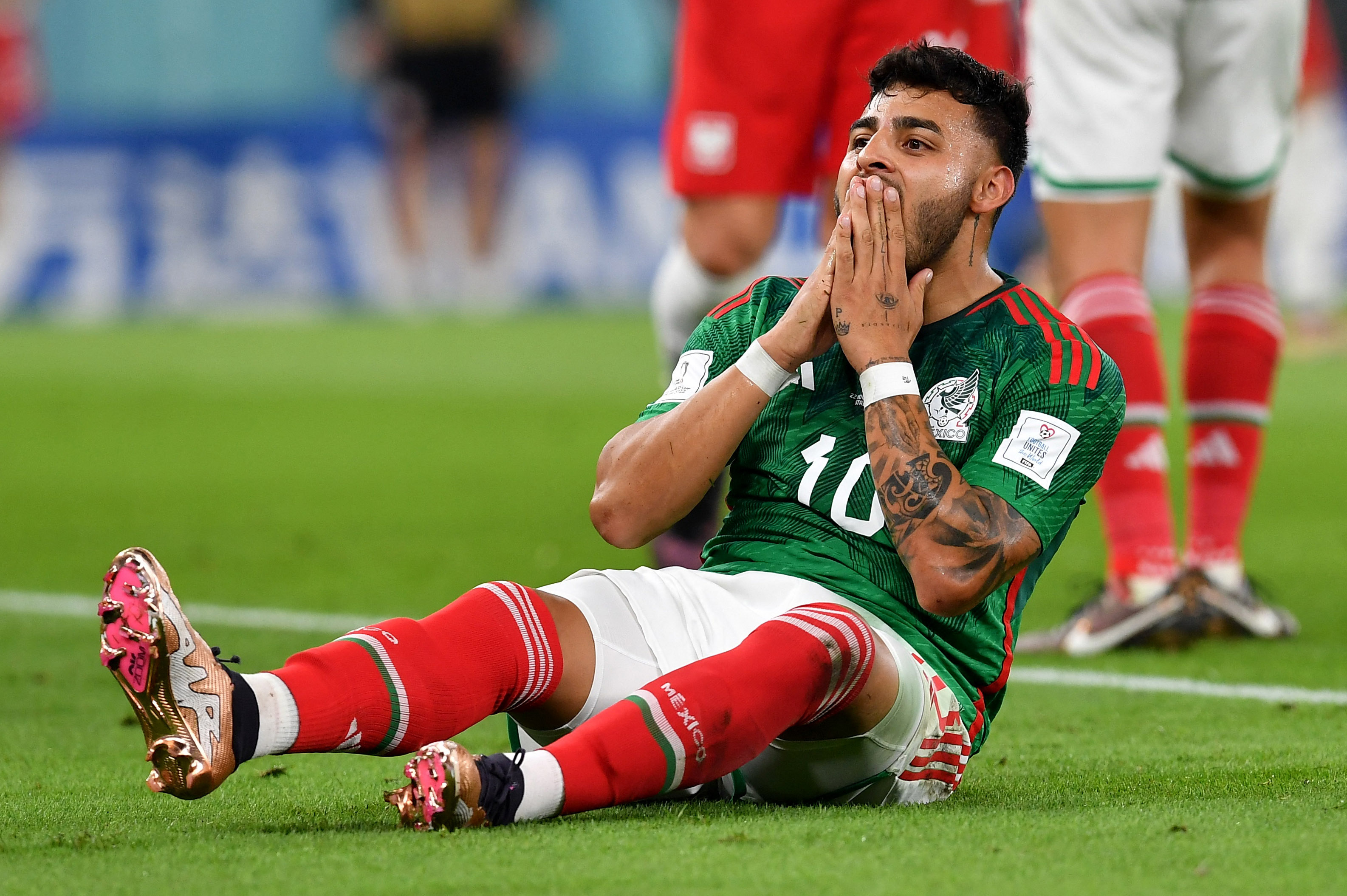 Soccer Football - FIFA World Cup Qatar 2022 - Group C - Mexico v Poland - Stadium 974, Doha, Qatar - November 22, 2022 Mexico's Alexis Vega reacts REUTERS/Jennifer Lorenzini