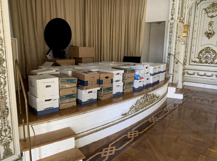 Boxes with secret documents deposited on the stage of the great White and Gold Ballroom of the Mar-a-Lago club, owned by Trump in Florida.  (US Justice Department/Handout via Reuters)