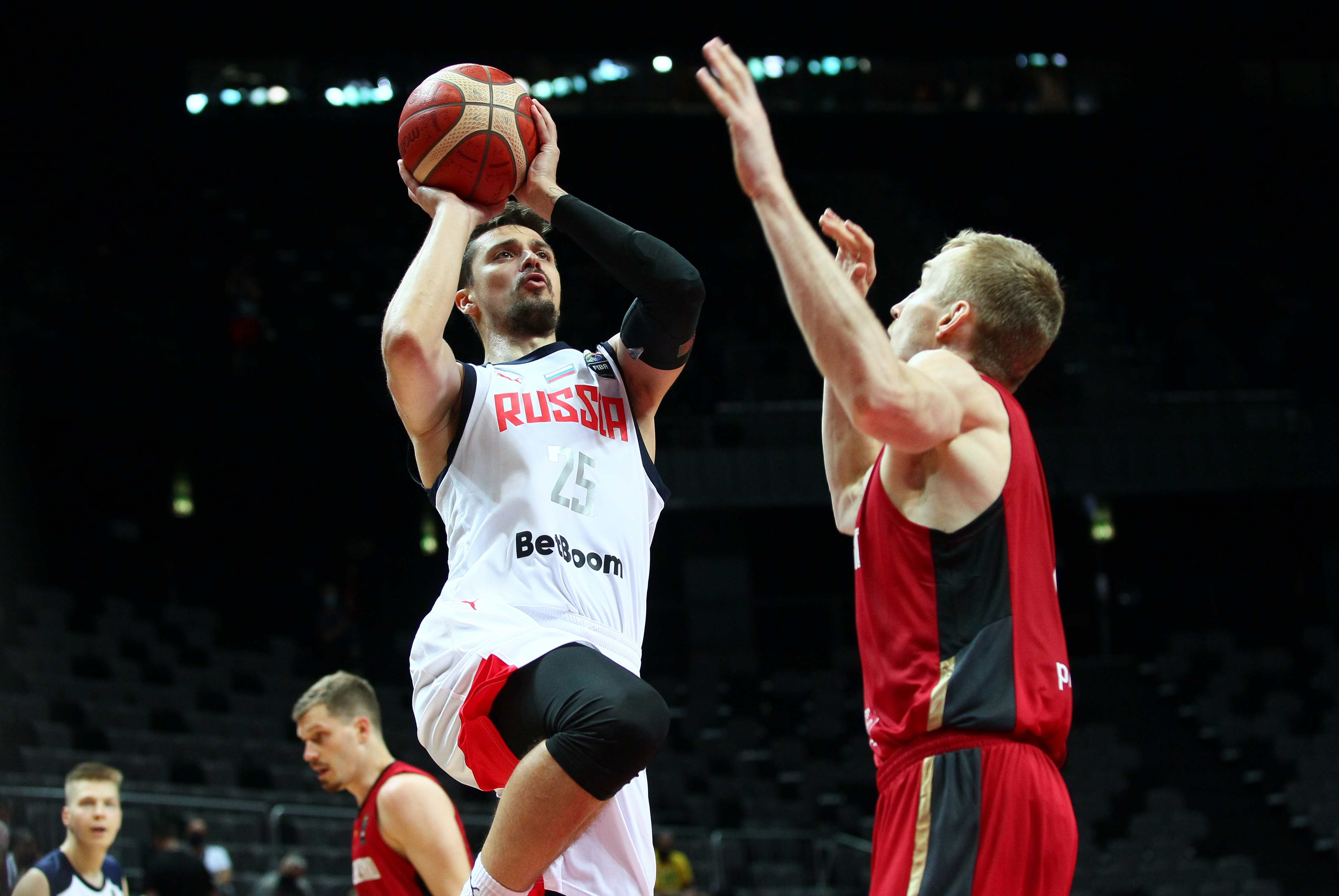Basketball - FIBA Olympic Qualifying Tournament - Russia v Germany - Spaladium Arena, Split, Croatia - July 1, 2021 Russia's Anton Astapkovich in action with Germany's Niels Giffey REUTERS/Antonio Bronic