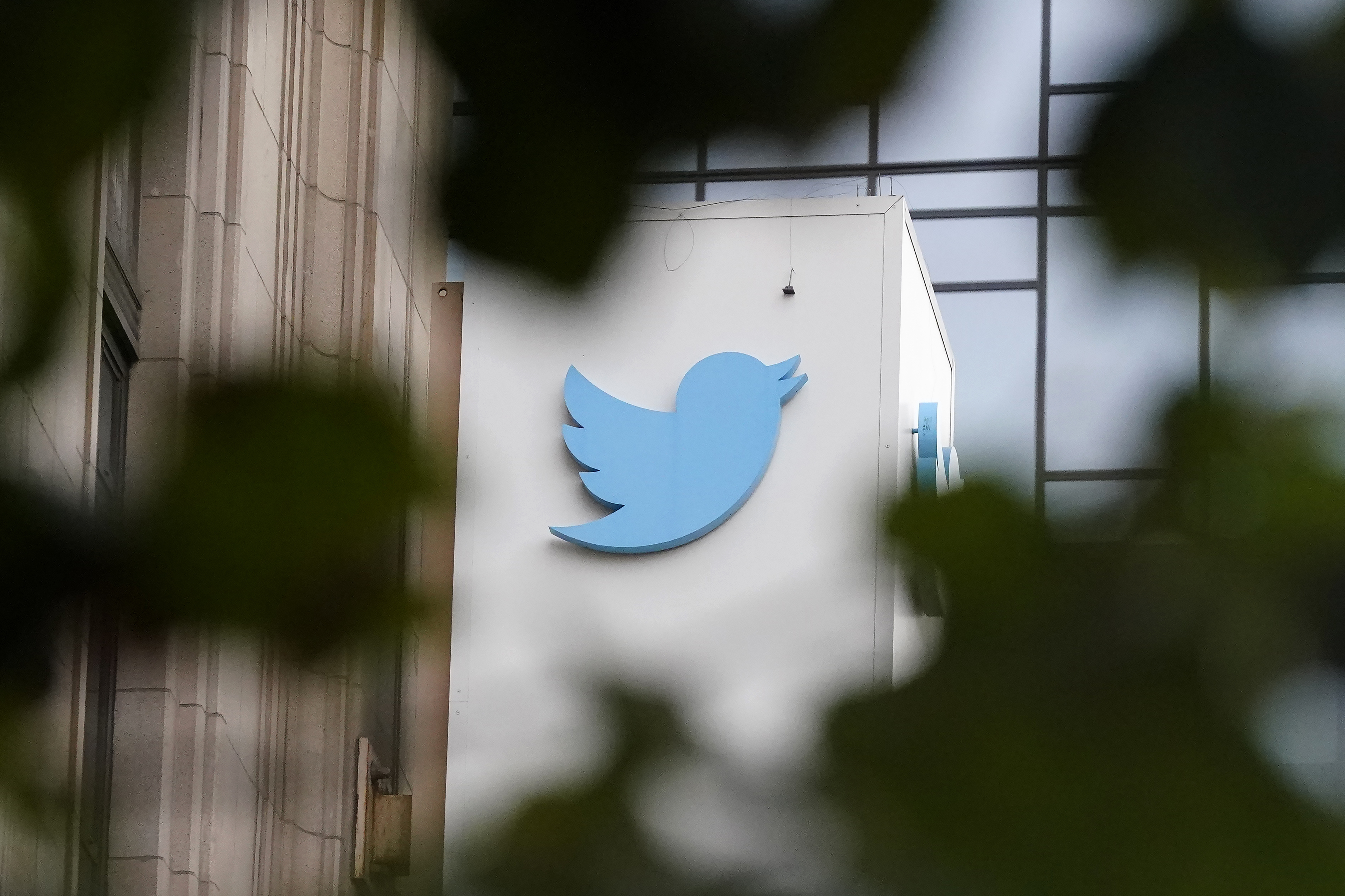 FILE - The Twitter logo is seen at the company's headquarters in San Francisco on Dec. 8, 2022. (AP Photo/Jeff Chiu, File)