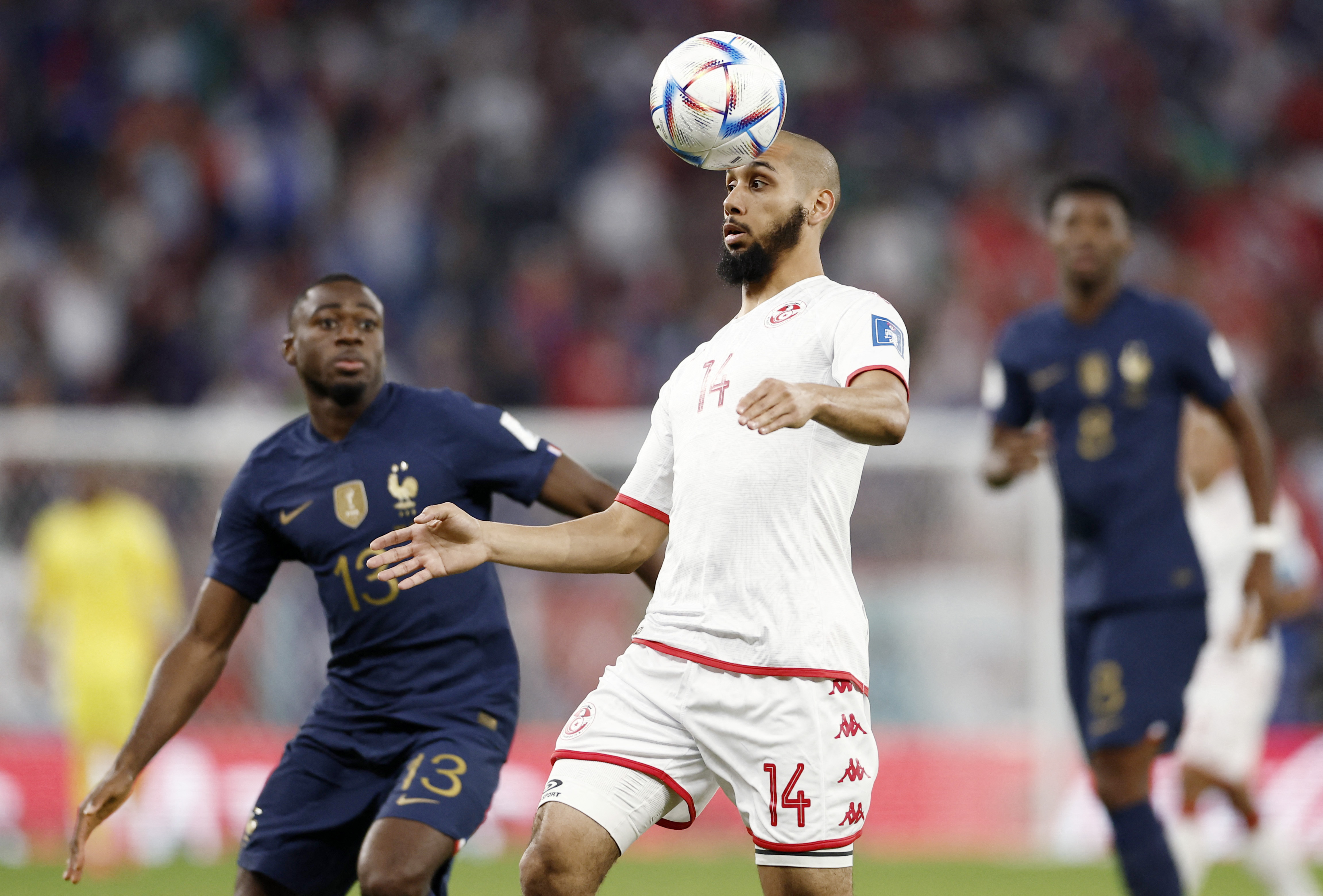 Soccer Football - FIFA World Cup Qatar 2022 - Group D - Tunisia v France - Education City Stadium, Al Rayyan, Qatar - November 30, 2022 Tunisia's Aissa Laidouni in action with France's Youssouf Fofana REUTERS/Benoit Tessier