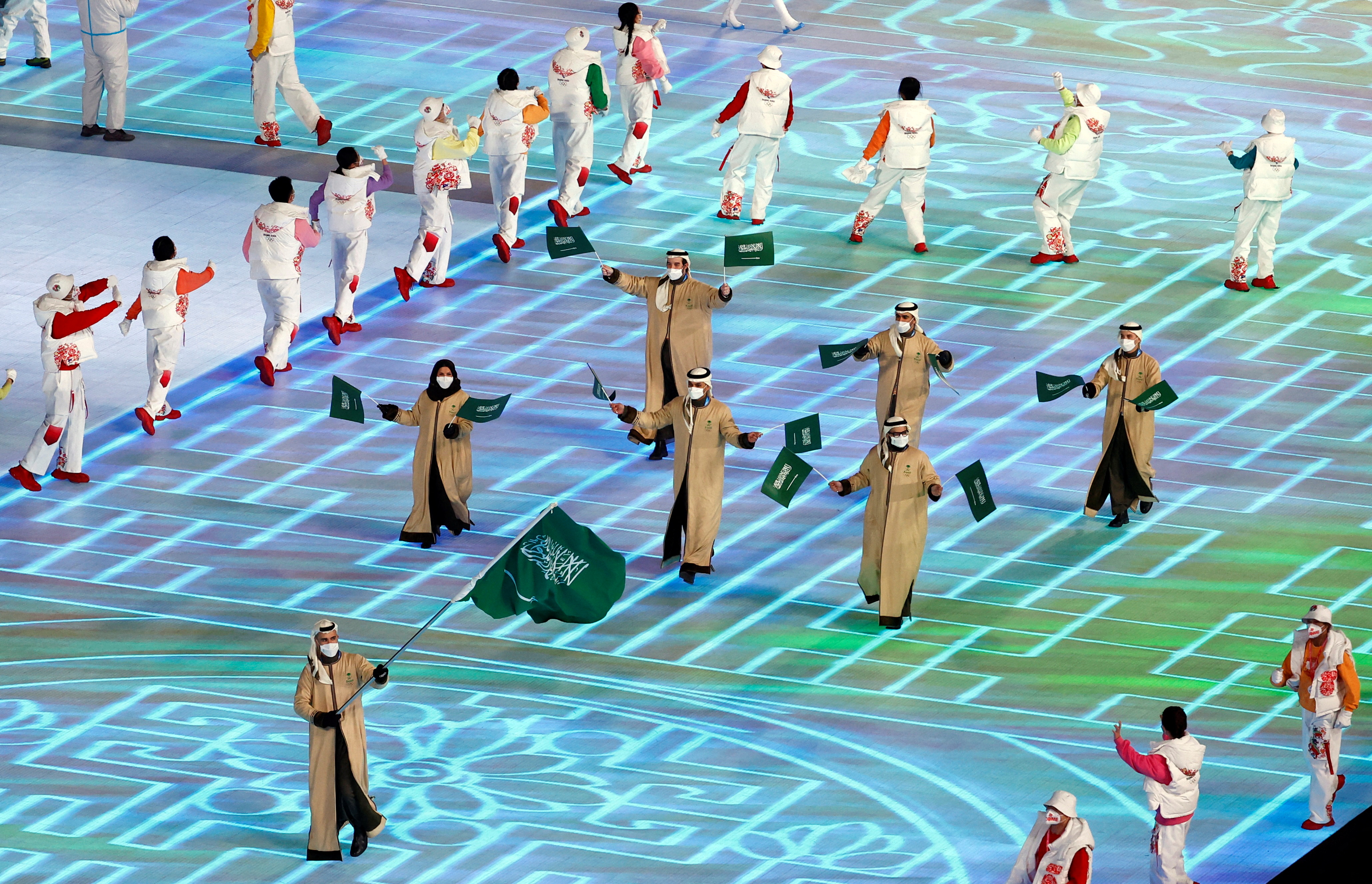 2022 Beijing Olympics - Opening Ceremony - National Stadium, Beijing, China - February 4, 2022. Flag bearer Fayik Abdi of Saudi Arabia during the athletes parade at the opening ceremony. REUTERS/Thomas Peter     SEARCH "OLYMPICS DAY 1" FOR BEIJING 2022 WINTER OLYMPICS EDITOR'S CHOICE, SEARCH "REUTERS OLYMPICS TOPIX" FOR ALL EDITOR'S CHOICE PICTURES.   TPX IMAGES OF THE DAY
