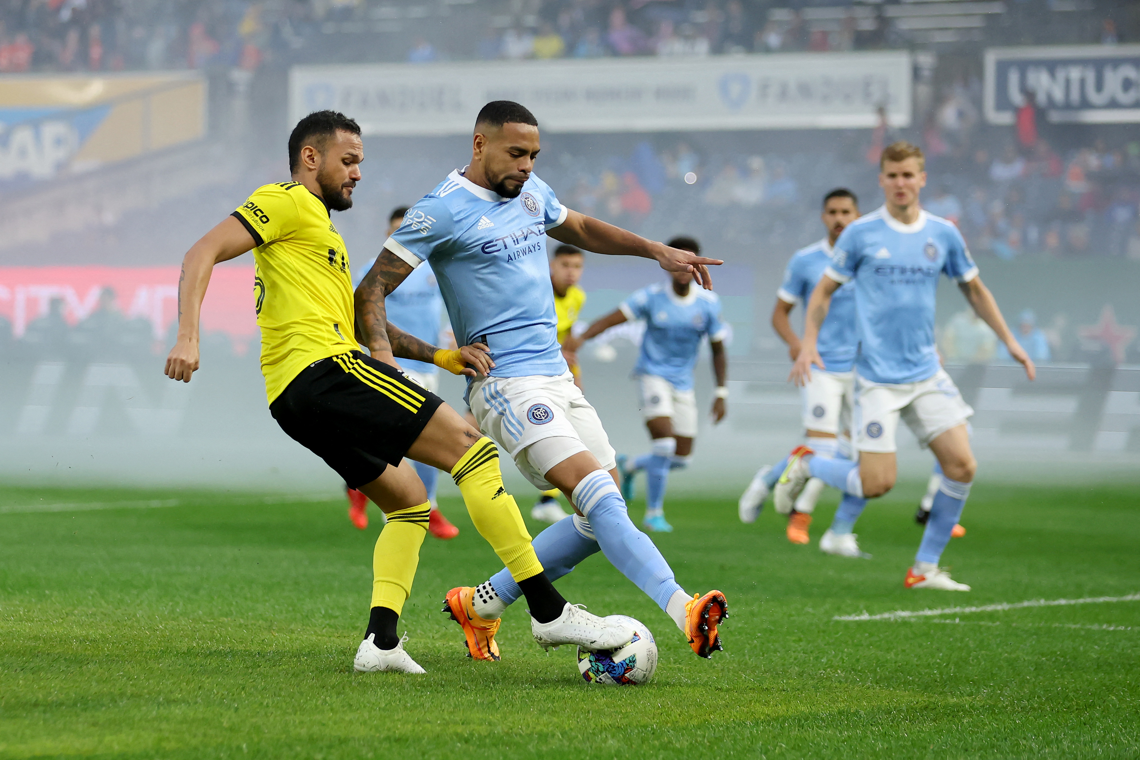 May 14, 2022; New York, New York, USA; Columbus Crew midfielder Artur (8) and New York City FC defender Alexander Callens (6) fight for the ball during the first half at Yankee Stadium. Mandatory Credit: Brad Penner-USA TODAY Sports