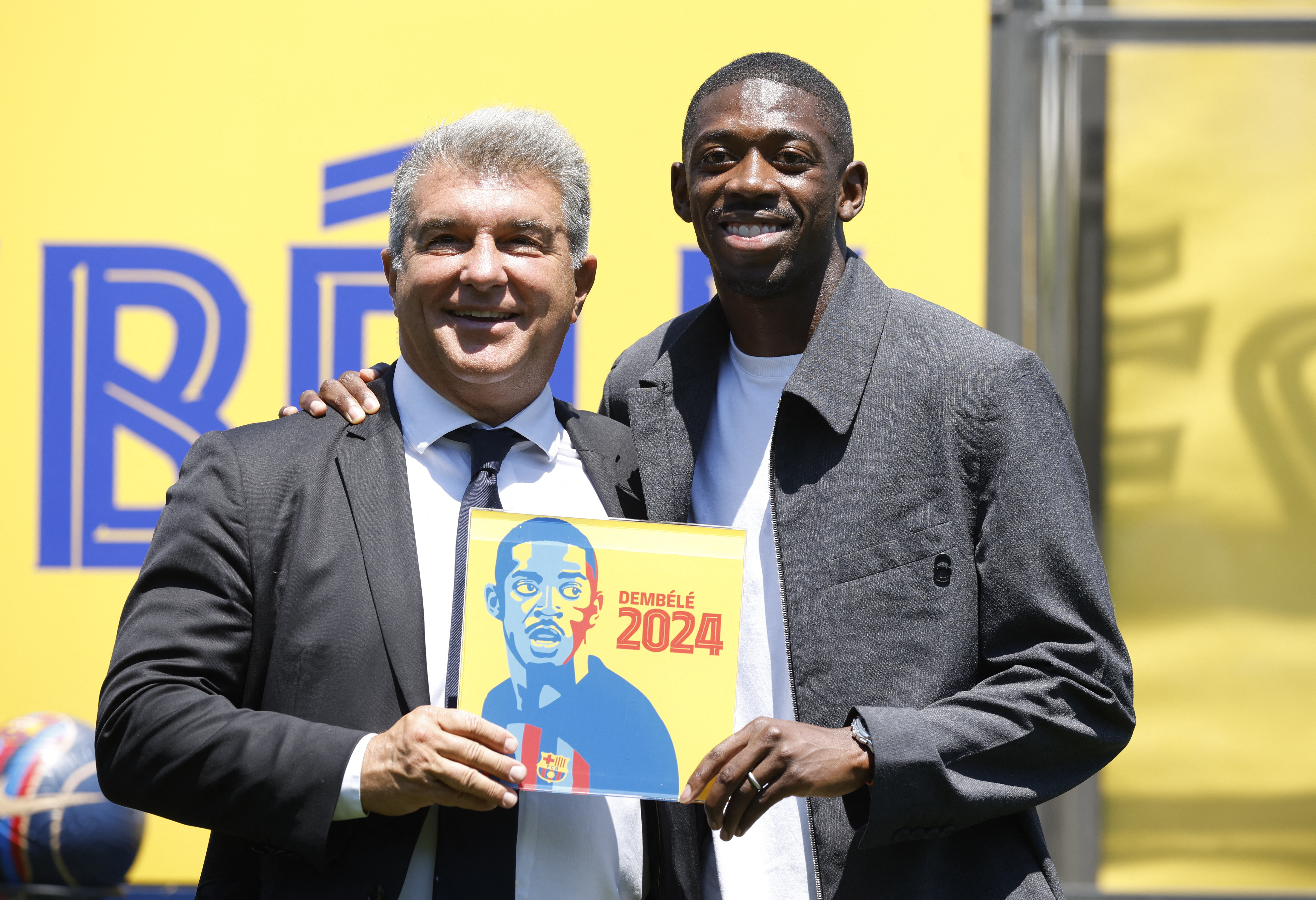   Joan Laporta and Ousmane Dembele posing after the renewal signed by the French 