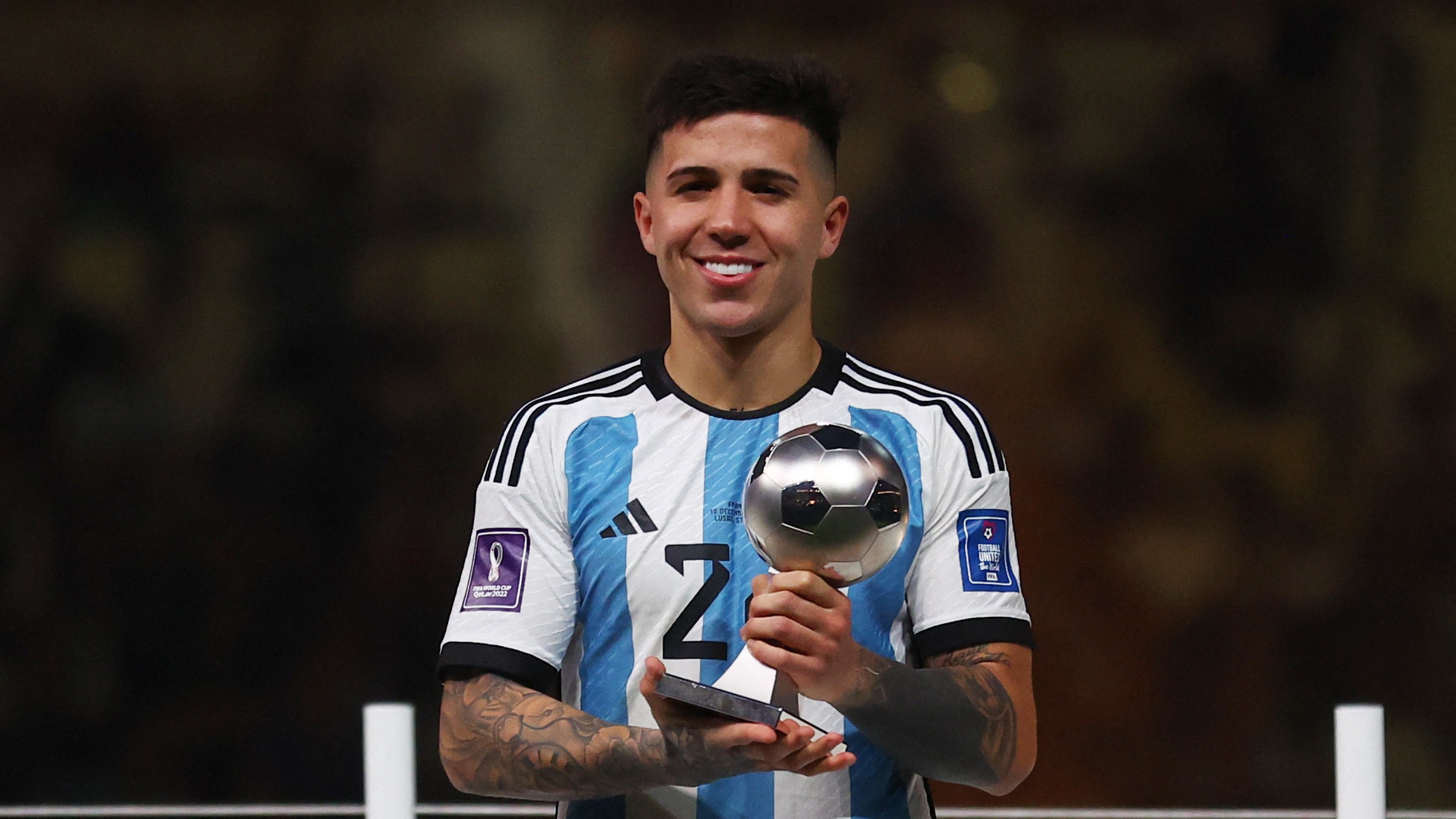 Soccer Football - FIFA World Cup Qatar 2022 - Final - Argentina v France - Lusail Stadium, Lusail, Qatar - December 18, 2022 Argentina's Enzo Fernandez poses with the Best Young Player award trophy REUTERS/Carl Recine