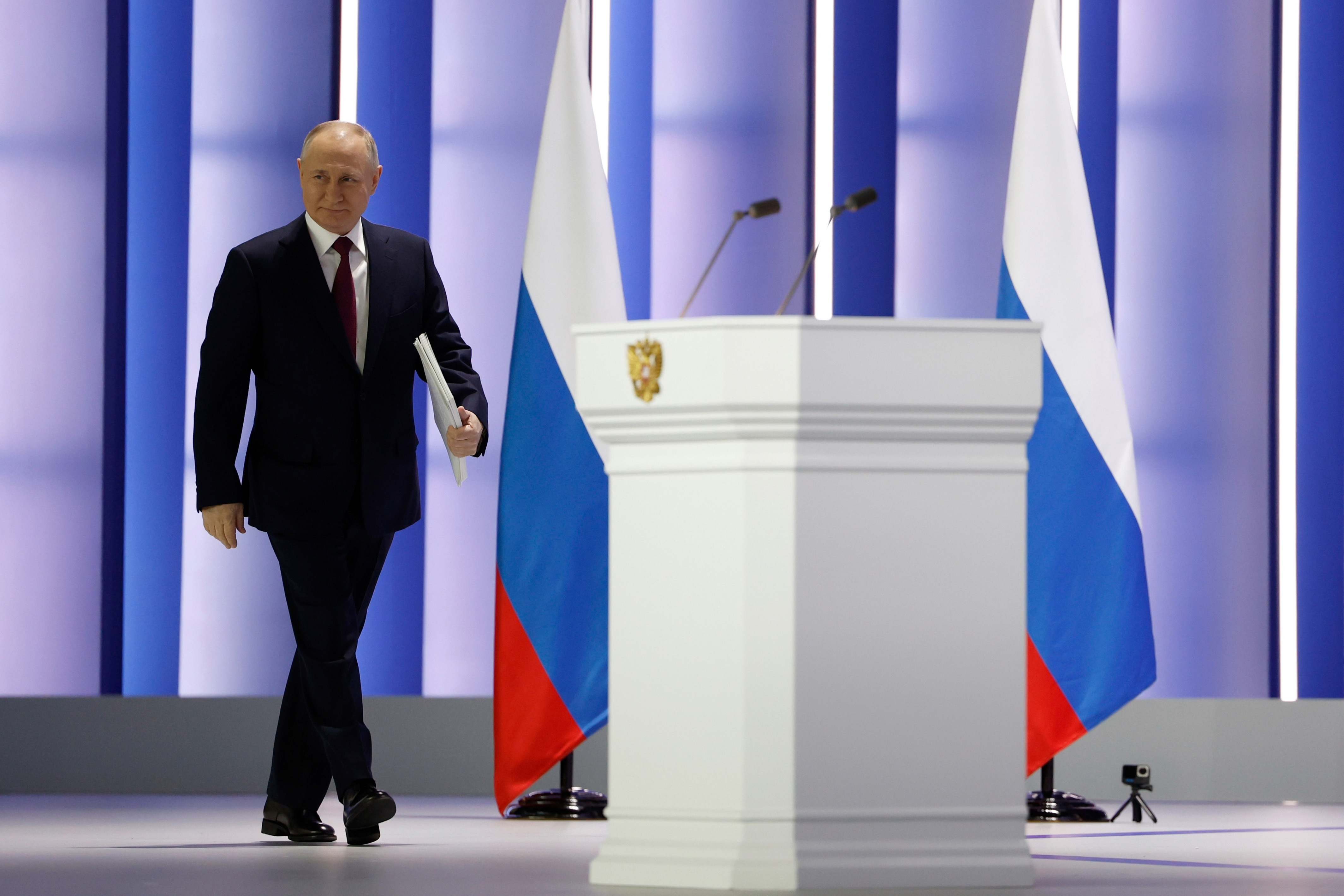 Russia's President Vladimir Putin arrives on stage for his annual state of the nation address, in Moscow, Russia, on February 21, 2023. (Dmitry Astakhov, Sputnik, Kremlin Pool Photo via AP)