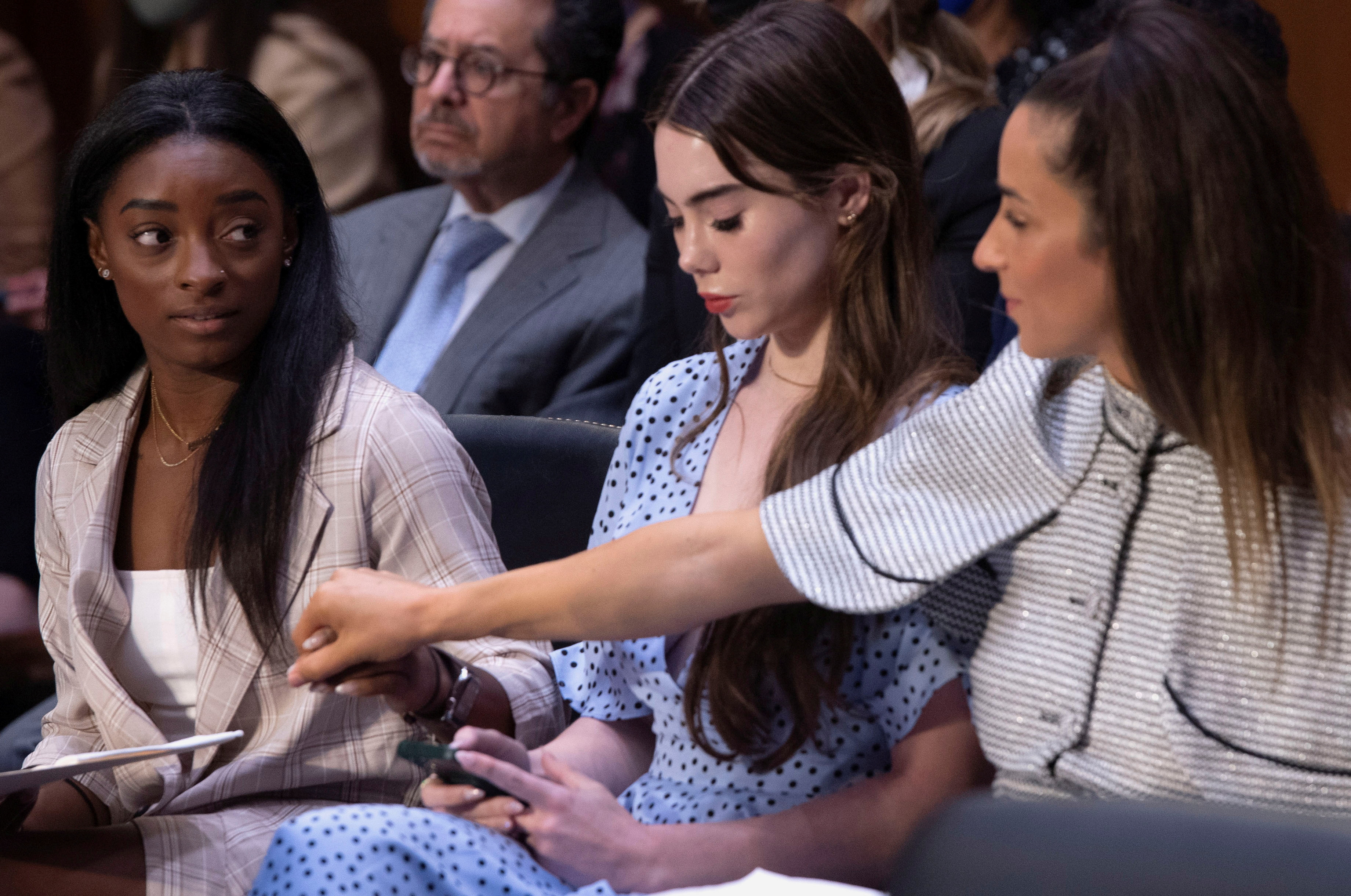 U.S. Olympic gymnasts Simone Biles, McKayla Maroney, Aly Raisman and Maggie Nichols (not pictured) arrive to testify during a Senate Judiciary hearing about the Inspector General's report on the FBI handling of the Larry Nassar investigation of sexual abuse of Olympic gymnasts, on Capitol Hill, in Washington, D.C., U.S., September 15, 2021. Saul Loeb/Pool via REUTERS