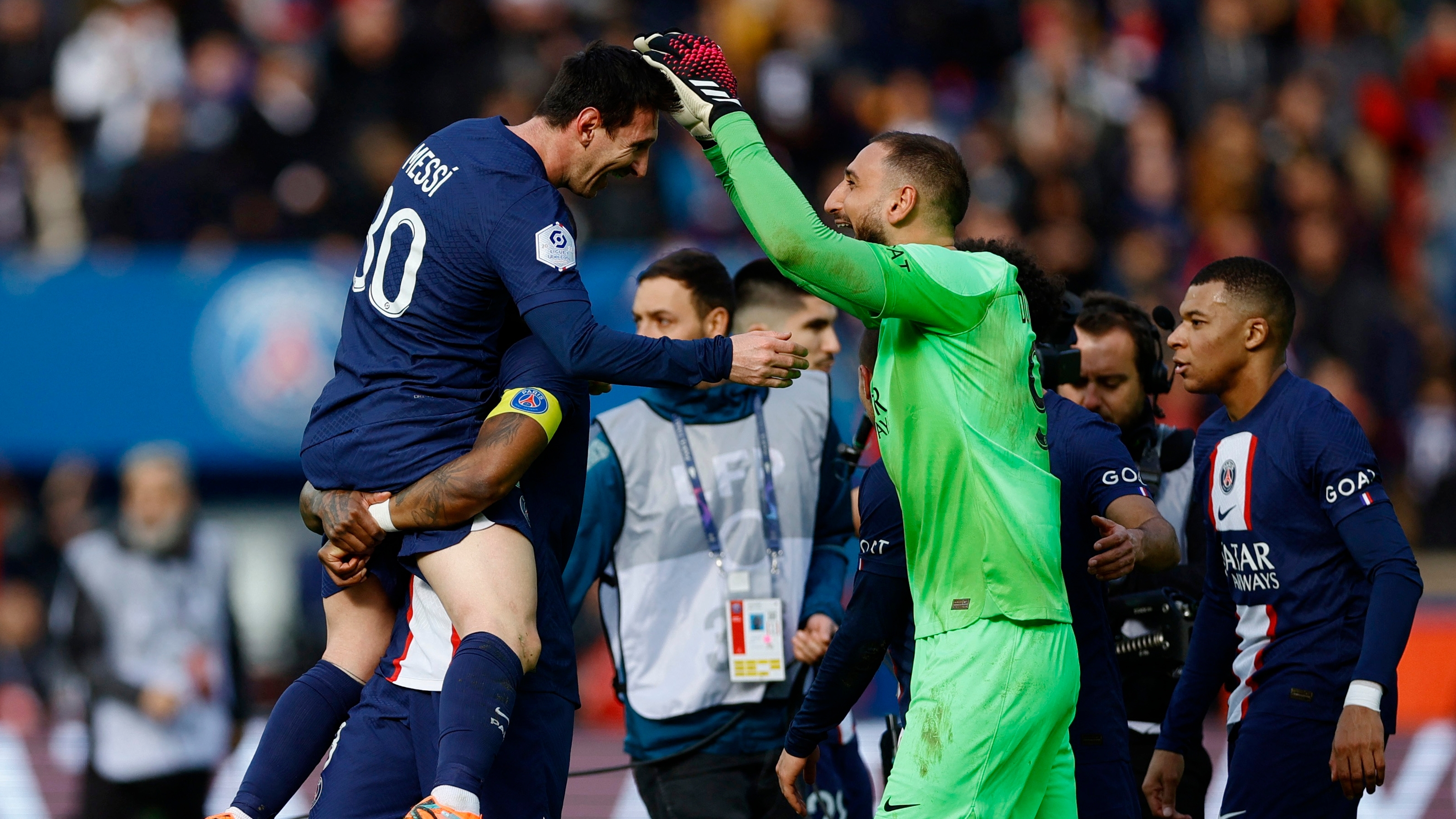 Soccer Football - Ligue 1 - Paris St Germain v Lille - Parc des Princes, Paris, France - February 19, 2023 Paris St Germain's Lionel Messi, Presnel Kimpembe and Gianluigi Donnarumma celebrate after the match REUTERS/Sarah Meyssonnier