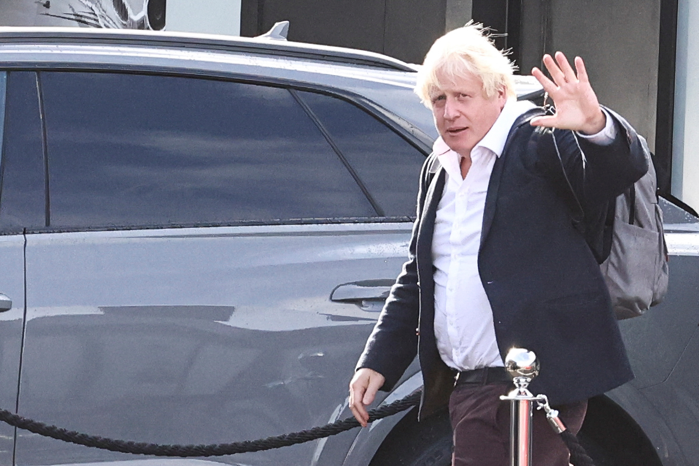 Former British Prime Minister Boris Johnson walks, at Gatwick Airport, near London, Britain October 22, 2022. REUTERS/Henry Nicholls