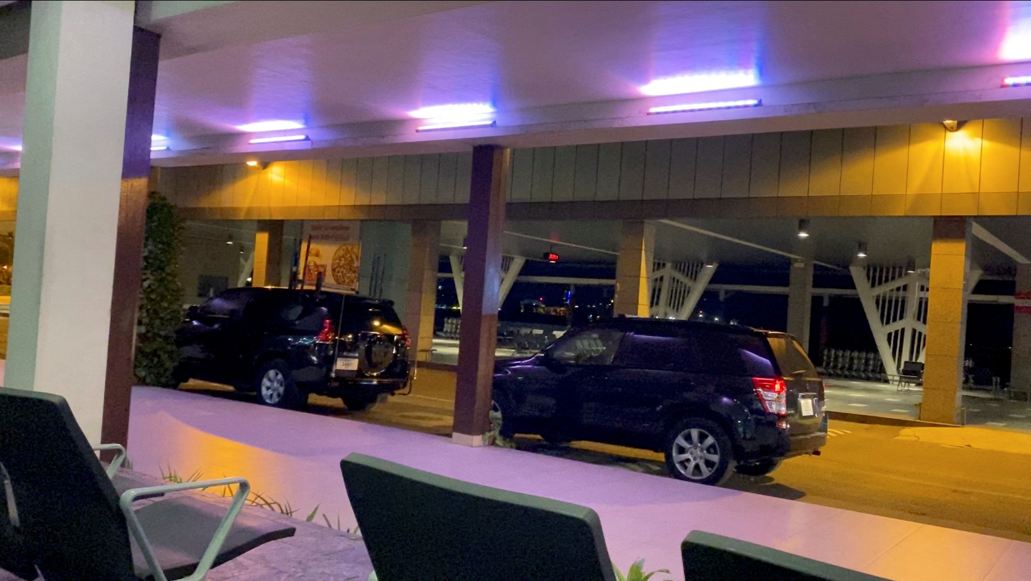 Vehicles parked in front of the VIP terminal of the Maldives airport in Malé, Maldives, on July 13, 2022 in this screenshot obtained from a video from social networks.  (Hathaavees via REUTERS)