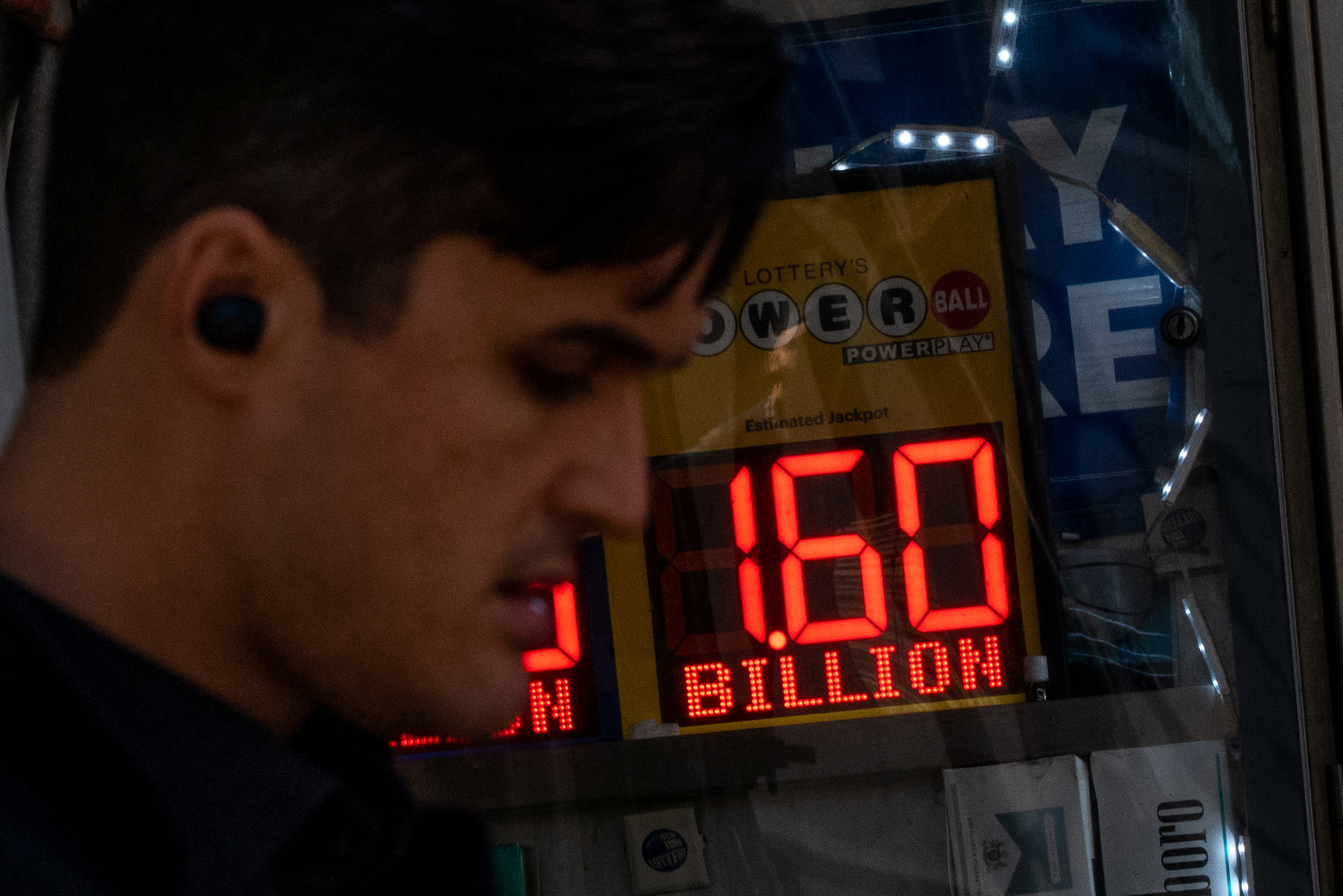 A digital billboard advertising the $1.6 billion Powerball jackpot is displayed in New York City