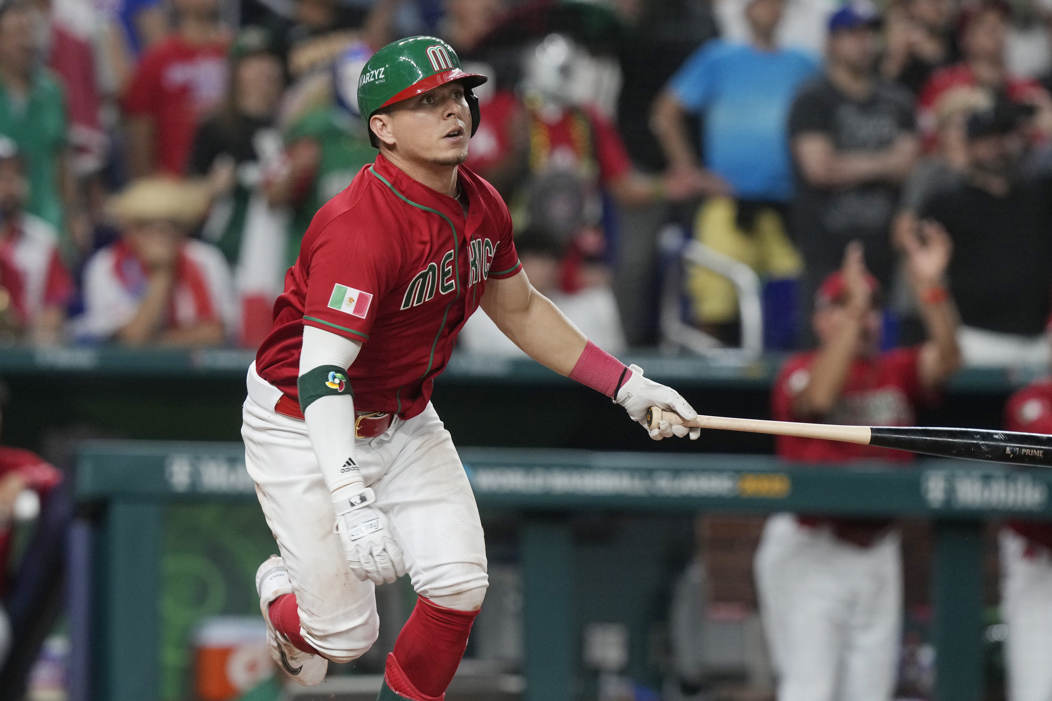Mexican Luis Urías (3) hits a single to right field during the seventh inning of the World Baseball Classic game against Puerto Rico, Friday, March 17, 2023, in Miami.  Mexico defeated Puerto Rico 5-4.  (AP Photo/Marta Lavandier)