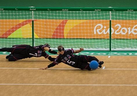 Handout image supplied by OIS/IOC showing (L-R) USA's Eliana Mason, Amanda Dennis and Asya Miller playing during the goalball Women's Preliminary Group C match against Brazil during the Rio 2016 Paralympic Games at the Future Arena in Rio de Janeiro, Brazil, on September 8, 2016.
Photo by Al Tielemans for OIS/IOC via AFP.  RESTRICTED TO EDITORIAL USE. / AFP / OIS/IOC / Al Tielemans for OIS/IOC        (Photo credit should read AL TIELEMANS FOR OIS/IOC/AFP/Getty Images)
