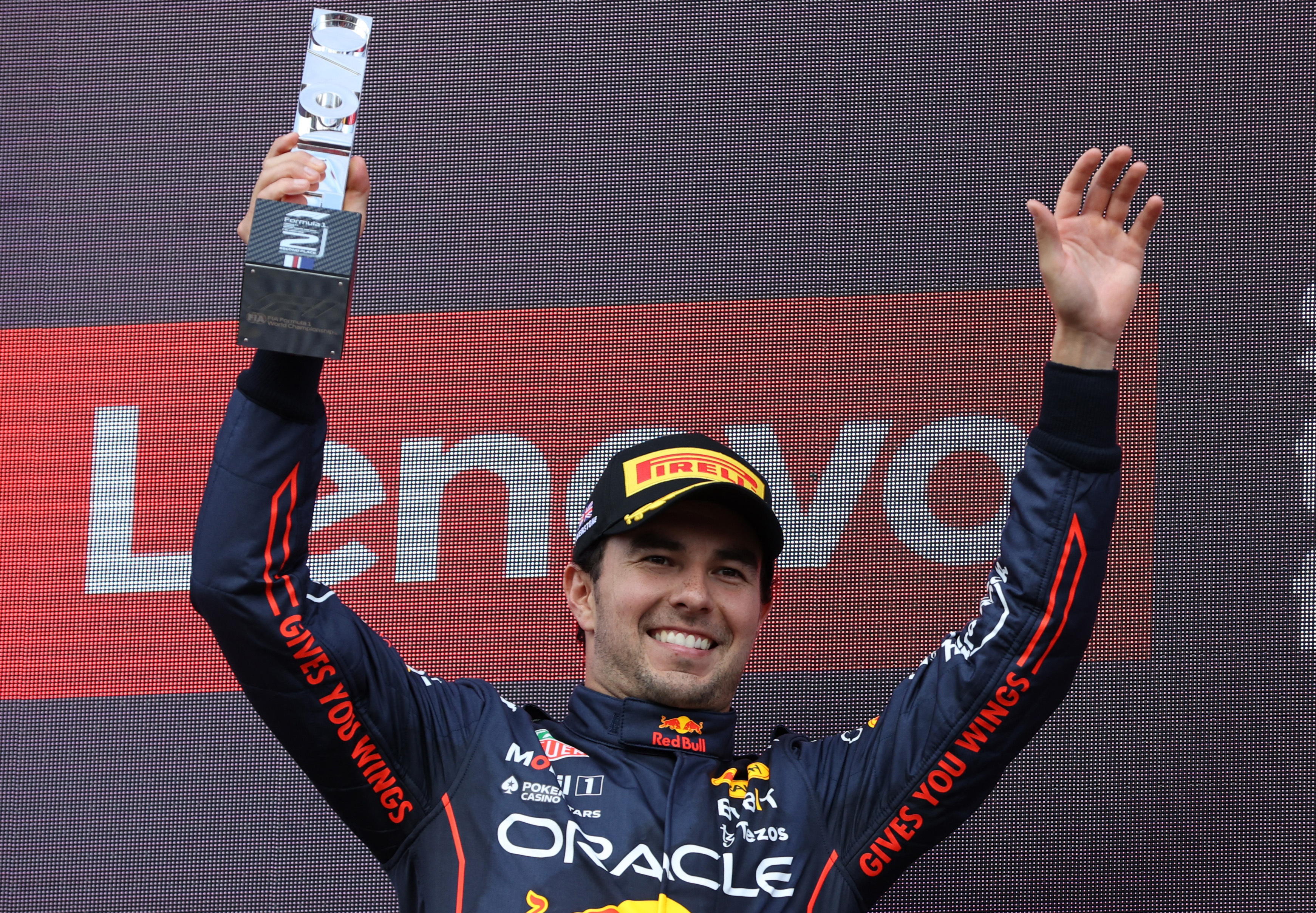 Formula One F1 - British Grand Prix - Silverstone Circuit, Silverstone, Britain - July 3, 2022 Red Bull's Sergio Perez celebrates on the podium with his trophy after finishing second in the race REUTERS/Molly Darlington