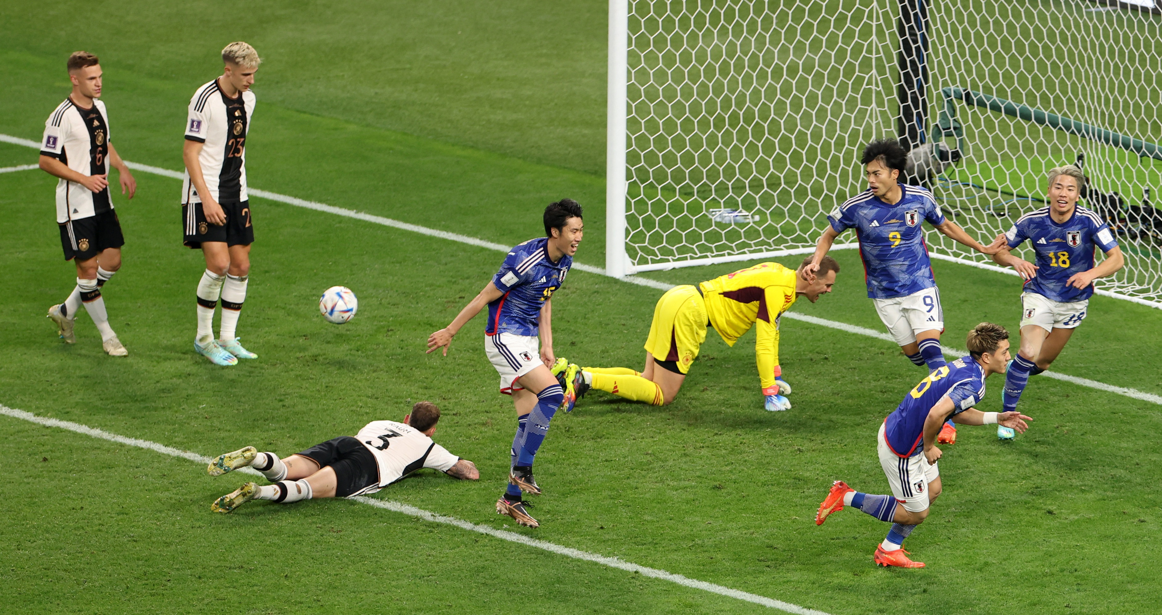 Soccer Football - FIFA World Cup Qatar 2022 - Group E - Germany v Japan - Khalifa International Stadium, Doha, Qatar - November 23, 2022 Japan's Ritsu Doan celebrates scoring their first goal with teammates REUTERS/Molly Darlington