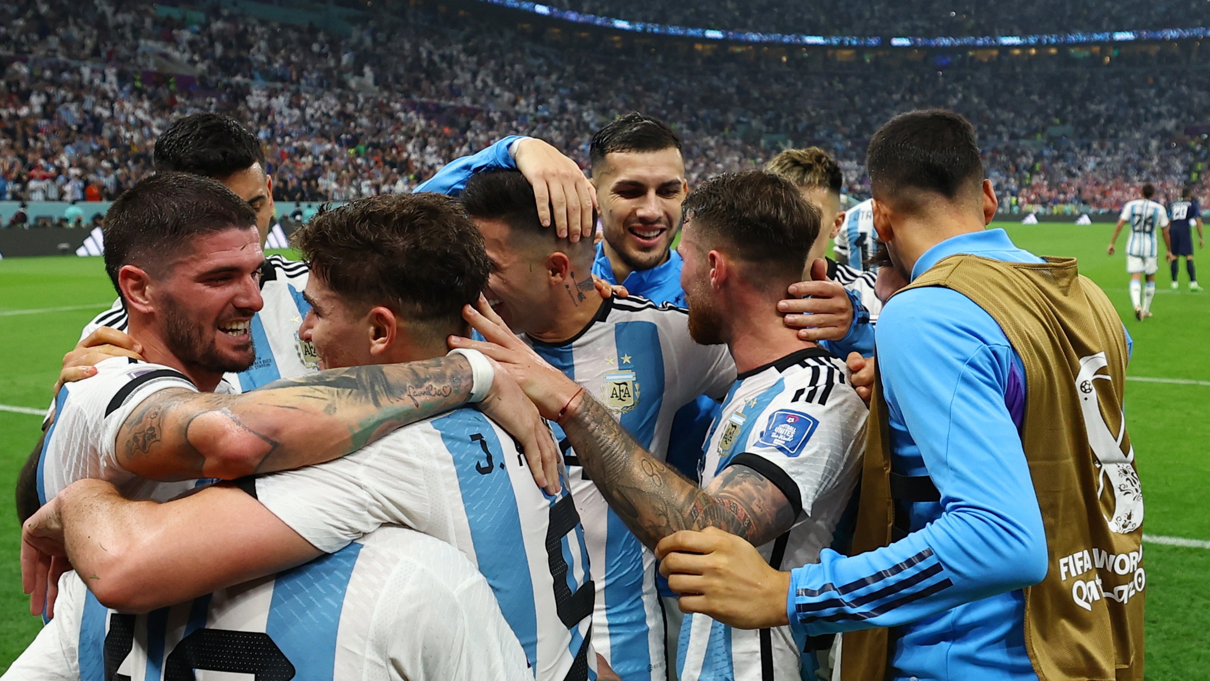 Soccer Football - FIFA World Cup Qatar 2022 - Semi Final - Argentina v Croatia - Lusail Stadium, Lusail, Qatar - December 13, 2022 Argentina's Julian Alvarez celebrates scoring their third goal with teammates REUTERS/Molly Darlington