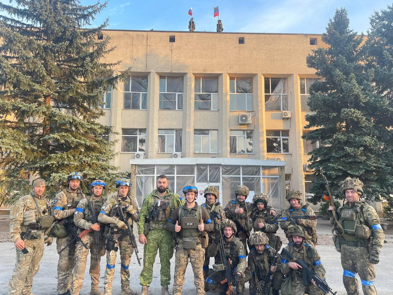 Ukrainian troops pose for a photo in Lyman, Ukraine, in this image released to social media on October 1, 2022. 