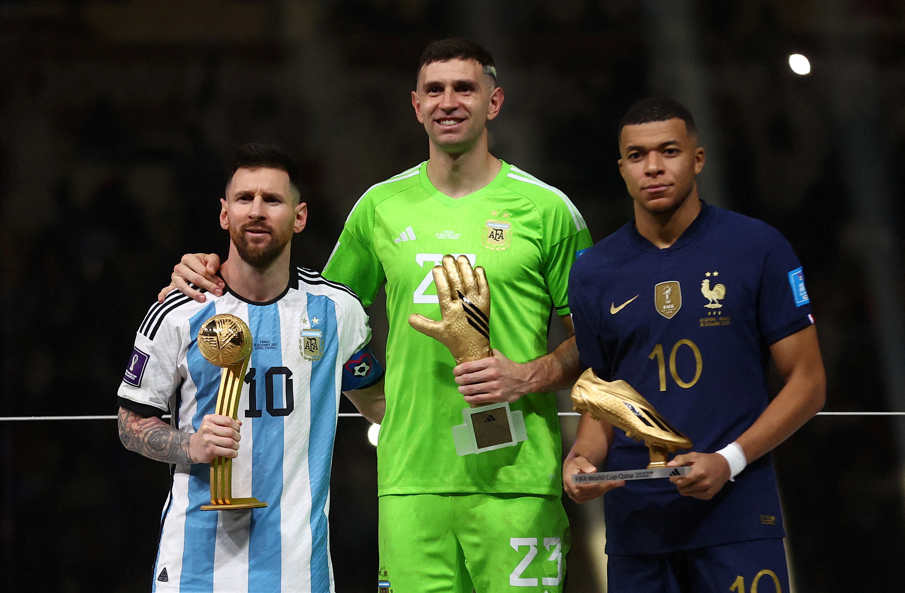 FILE PHOTO: Soccer Football - FIFA World Cup Qatar 2022 - Final - Argentina v France - Lusail Stadium, Lusail, Qatar - December 18, 2022 Golden Ball winner Argentina's Lionel Messi, Golden Glove winner Argentina's Emiliano Martinez and Golden Boot winner France's Kylian Mbappe pose with the trophies REUTERS/Carl Recine/File Photo