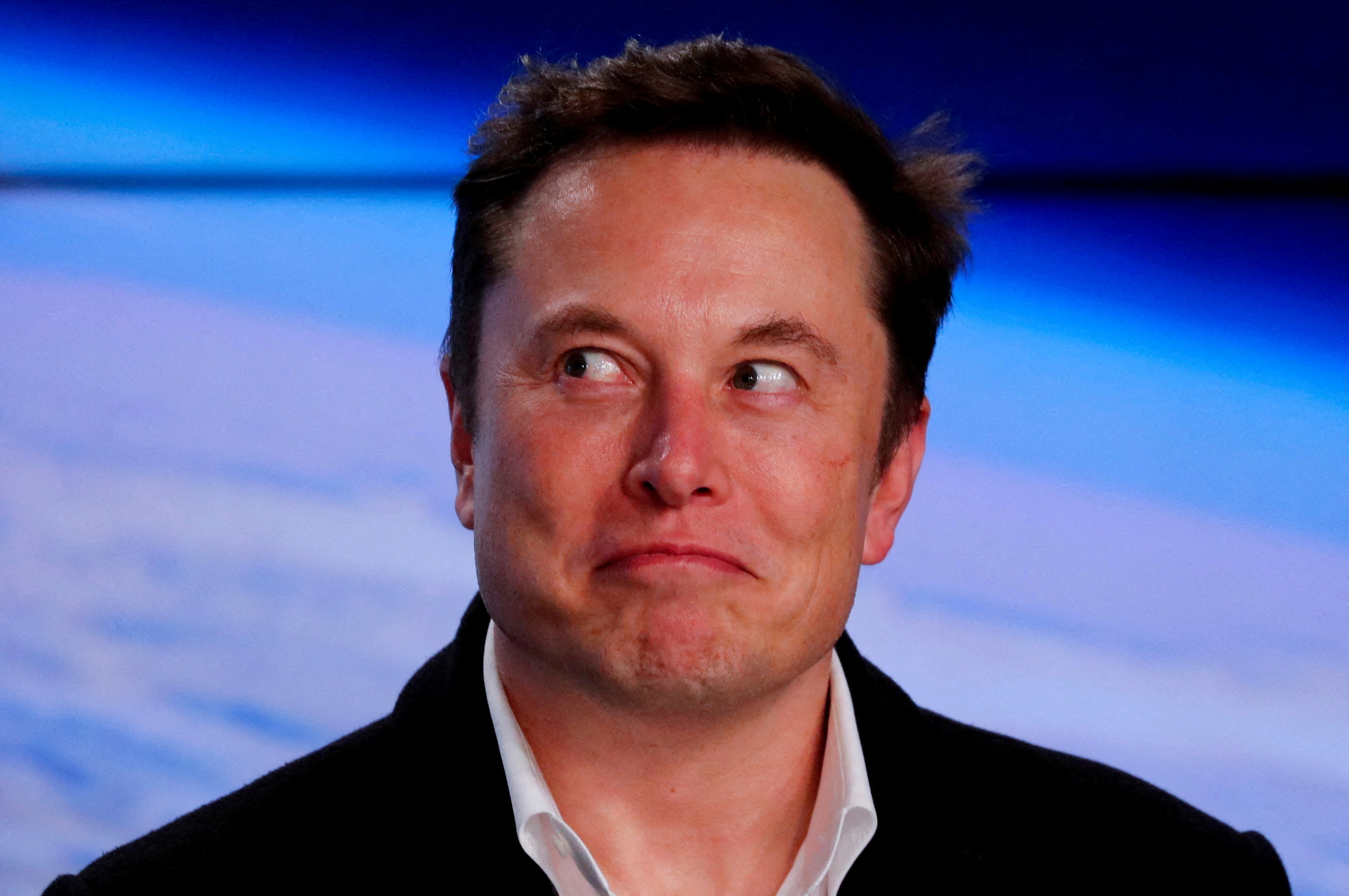 FILE PHOTO: SpaceX founder Elon Musk reacts at a post-launch news conference after the SpaceX Falcon 9 rocket, carrying the Crew Dragon spacecraft, lifted off on an uncrewed test flight to the International Space Station from the Kennedy Space Center in Cape Canaveral, Florida, U.S., March 2, 2019. REUTERS/Mike Blake/File Photo