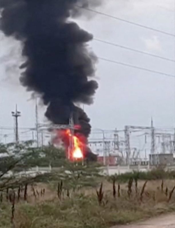 Smoke rising above a transformer power substation, which caught fire after an explosion in Dzhankoi district, Crimea