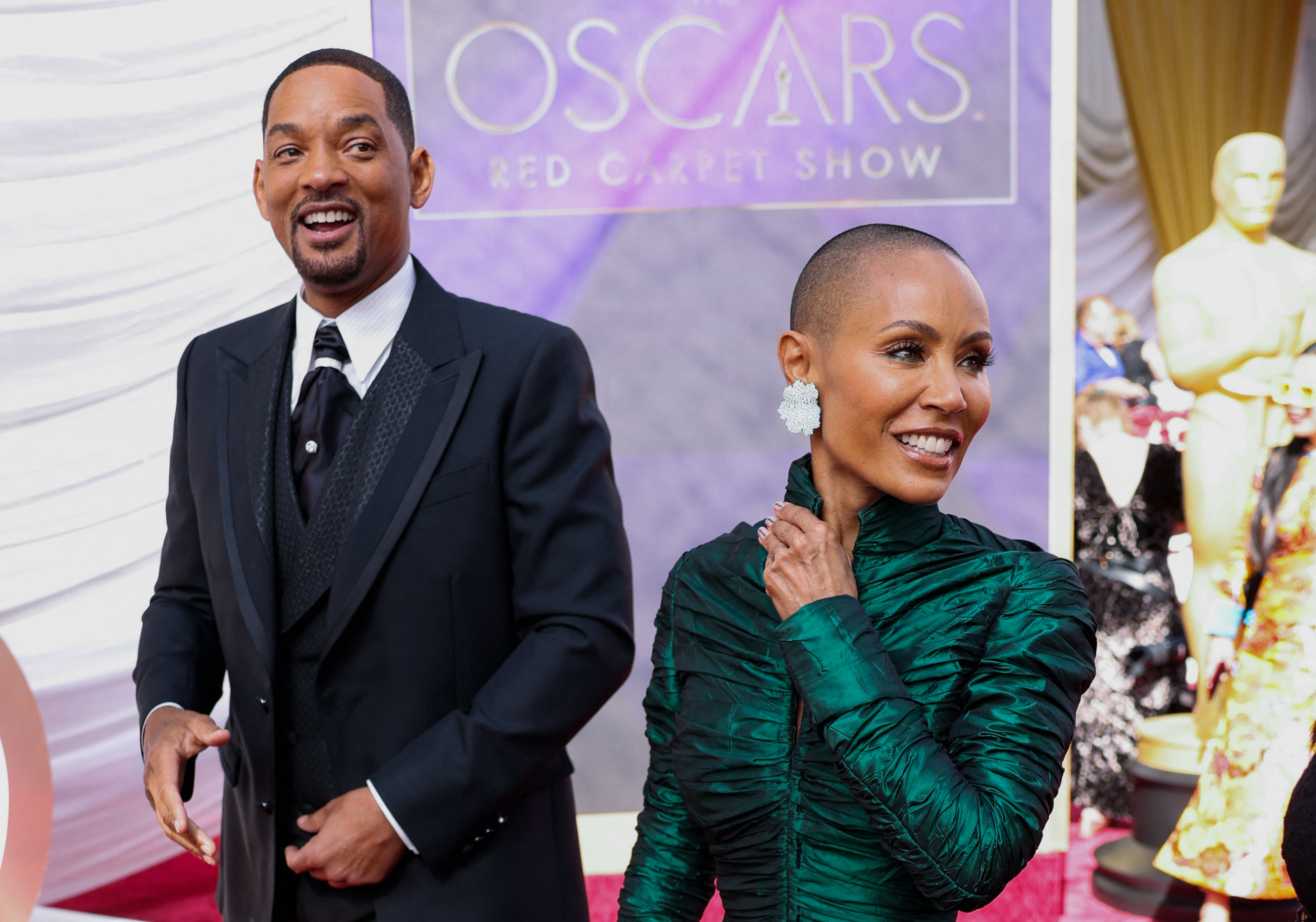 Will Smith and Jada Pinkett Smith pose on the red carpet during the Oscars arrivals at the 94th Academy Awards in Hollywood, Los Angeles, California, US, March 27, 2022. REUTERS/Mike Blake